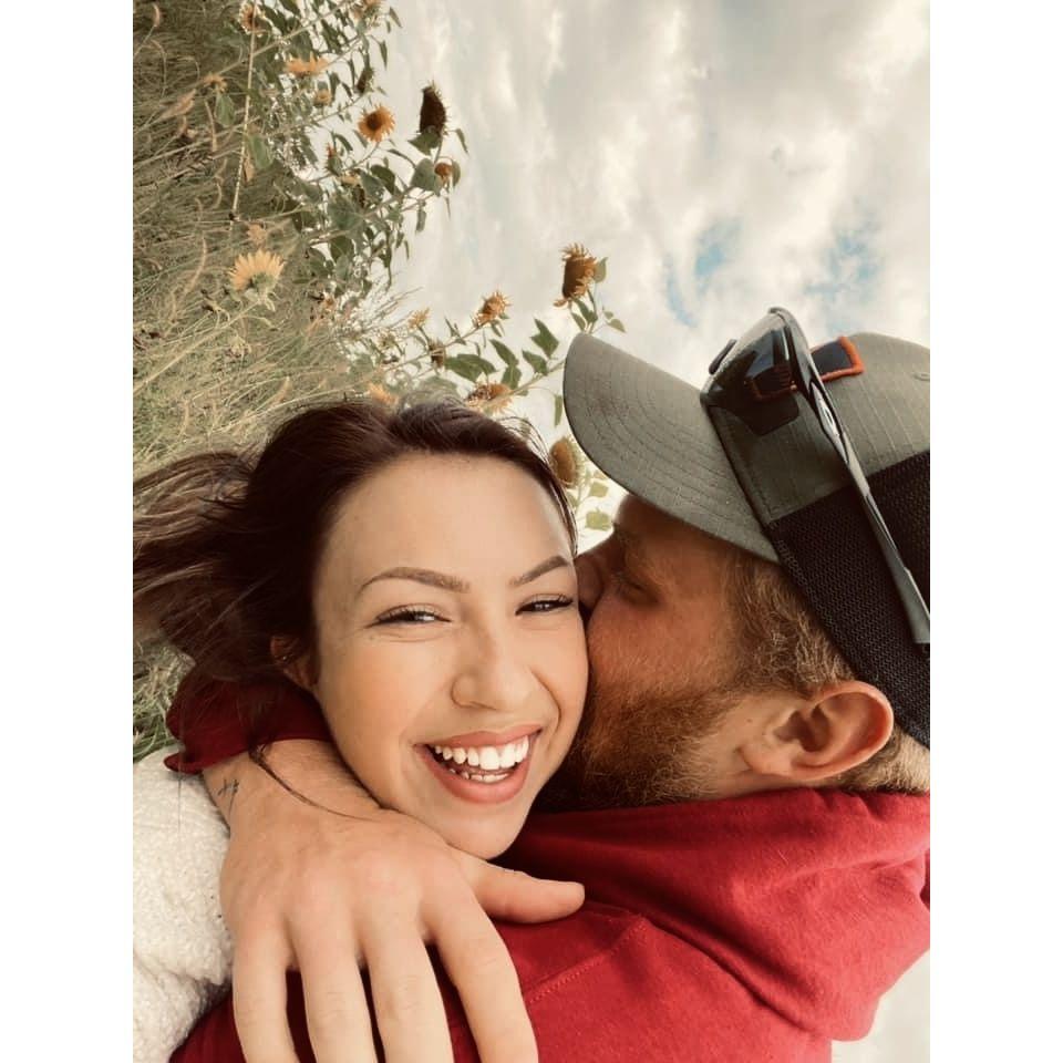 This picture was taken at one of the bride's favorite places, the pumpkin patch!