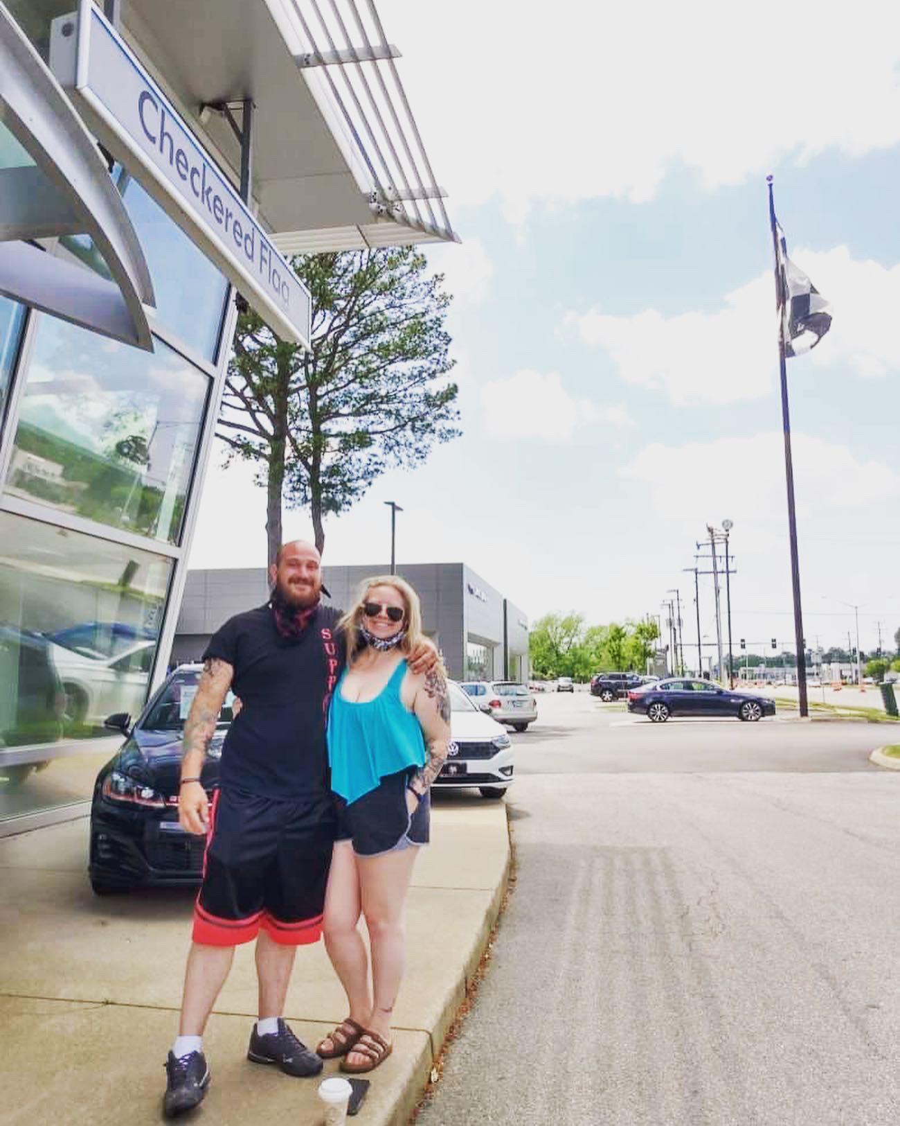 That time Bre and Kenny decided to go on a road trip to GA and got stuck in VA. Photo op at their local VW dealership.