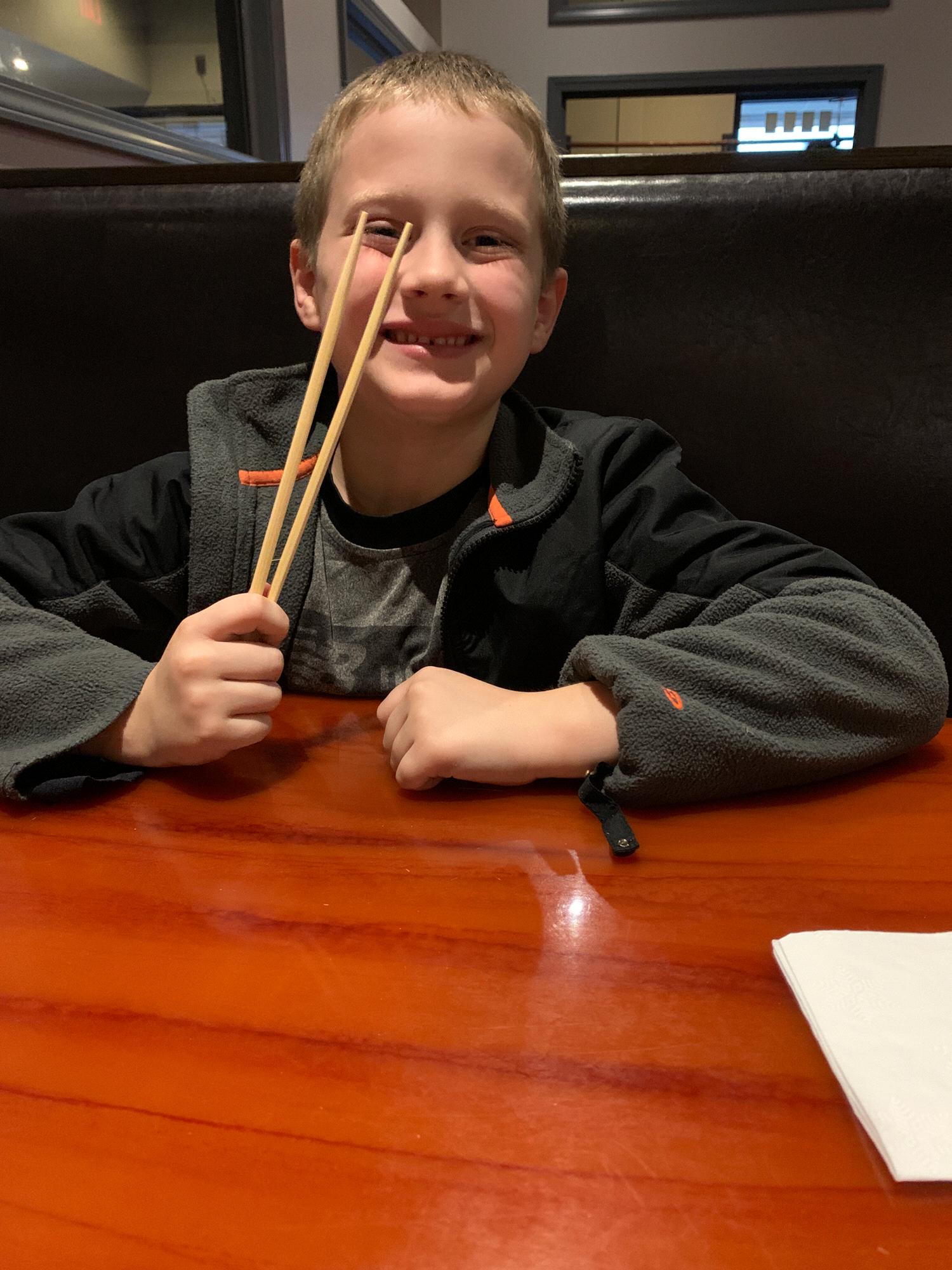 Cayleb trying Sushi and chopsticks for the first time.