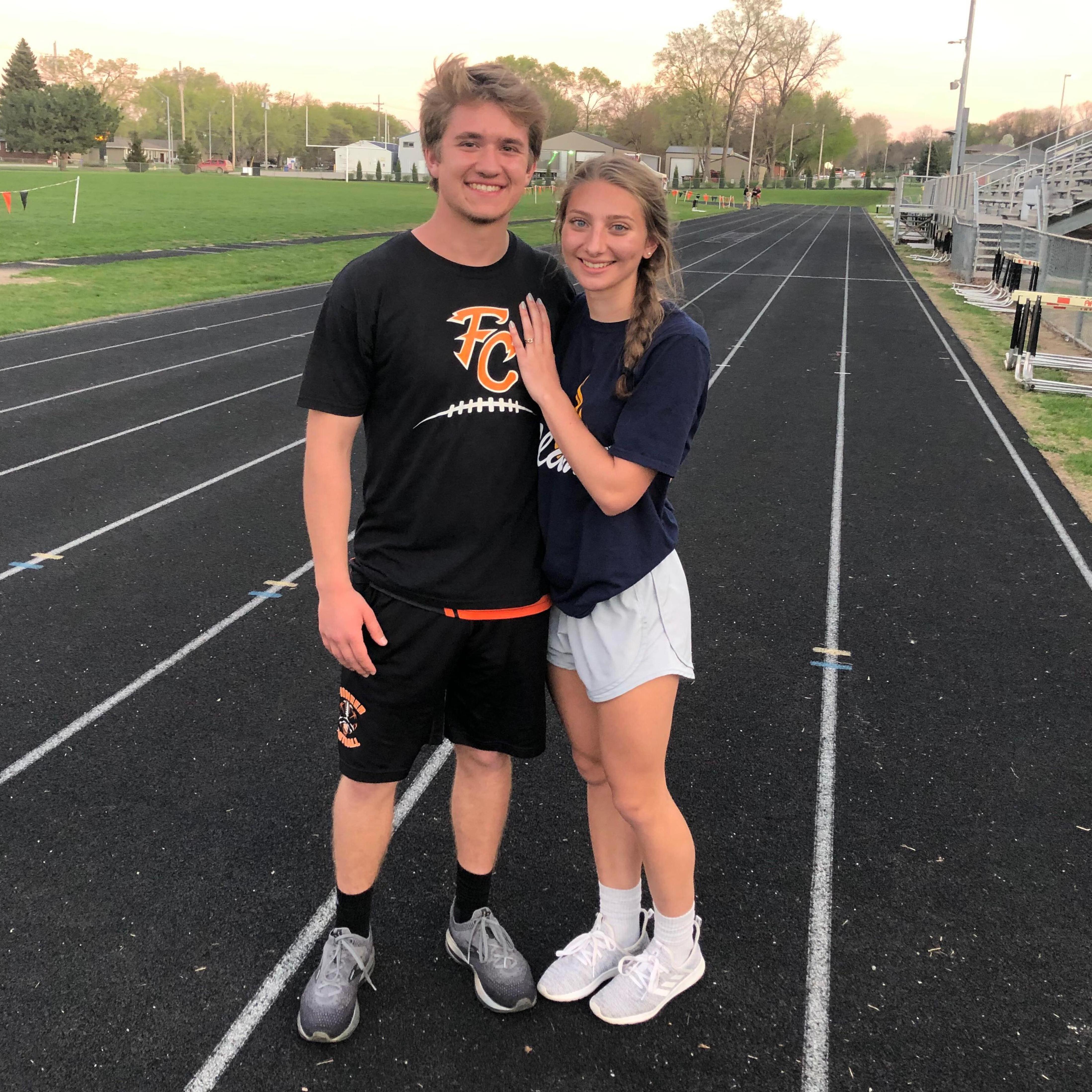 Aly supporting Aaron at one of his high school track meets