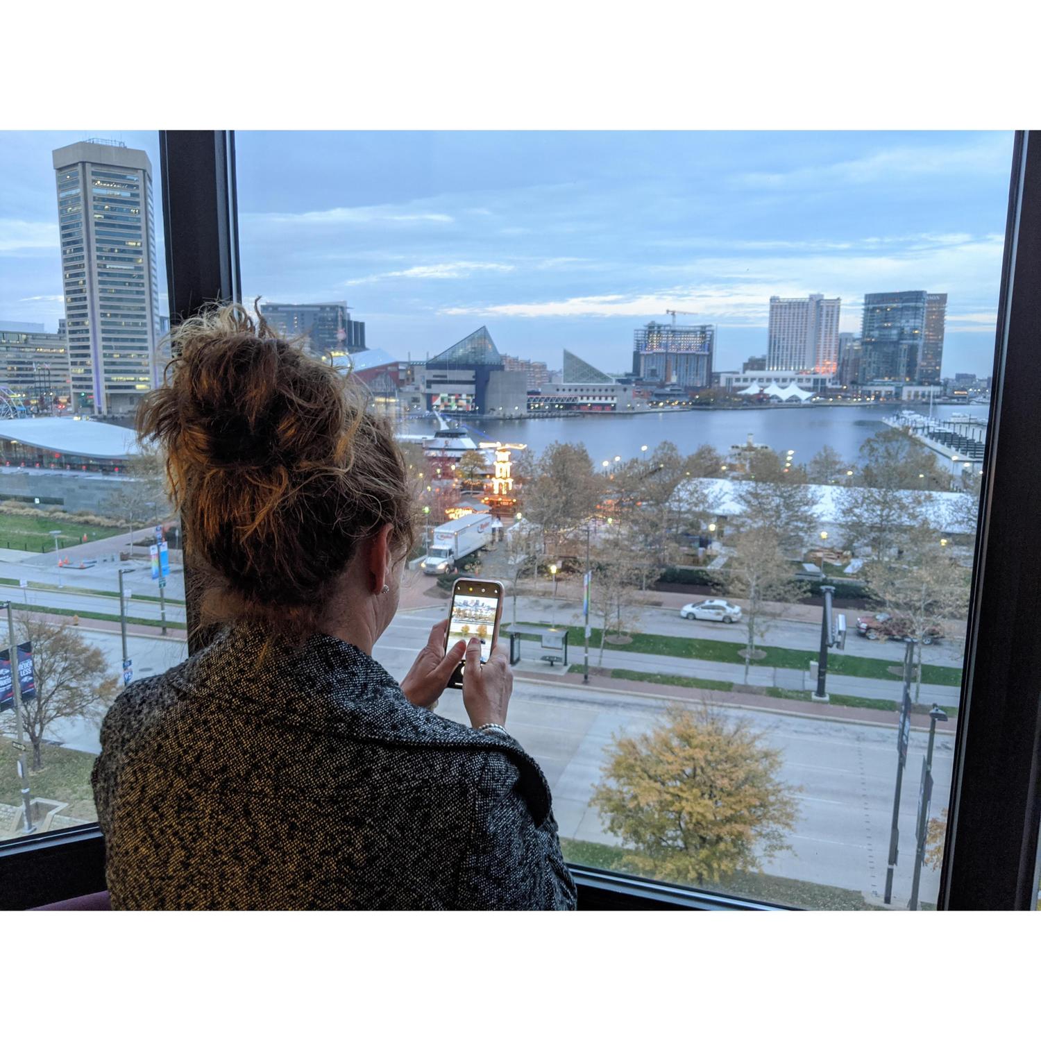 Monica taking a photo of the inner harbor right before we went to the Trans Siberian Orchestra concert in Baltimore in November 2019.