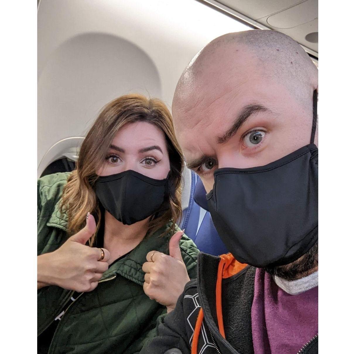 We have a tradition of masking up on flights and sending photos to the people we're visiting!
