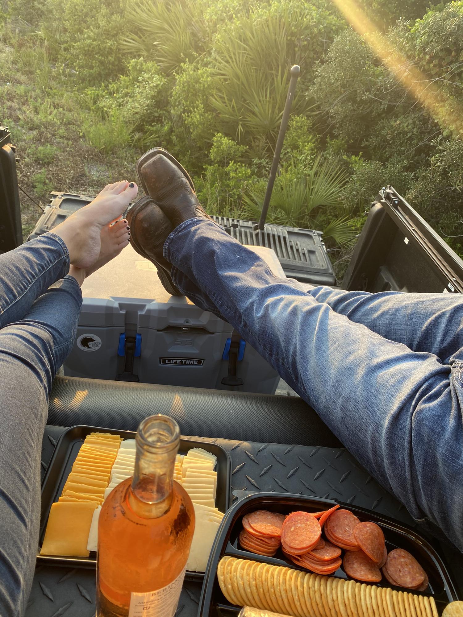 Fast forward a year to Candace’s Birthday. Enjoying one of our favorite ways to spend time together hanging out in the back of his truck with wine, a charcuterie board, and the sunset.
