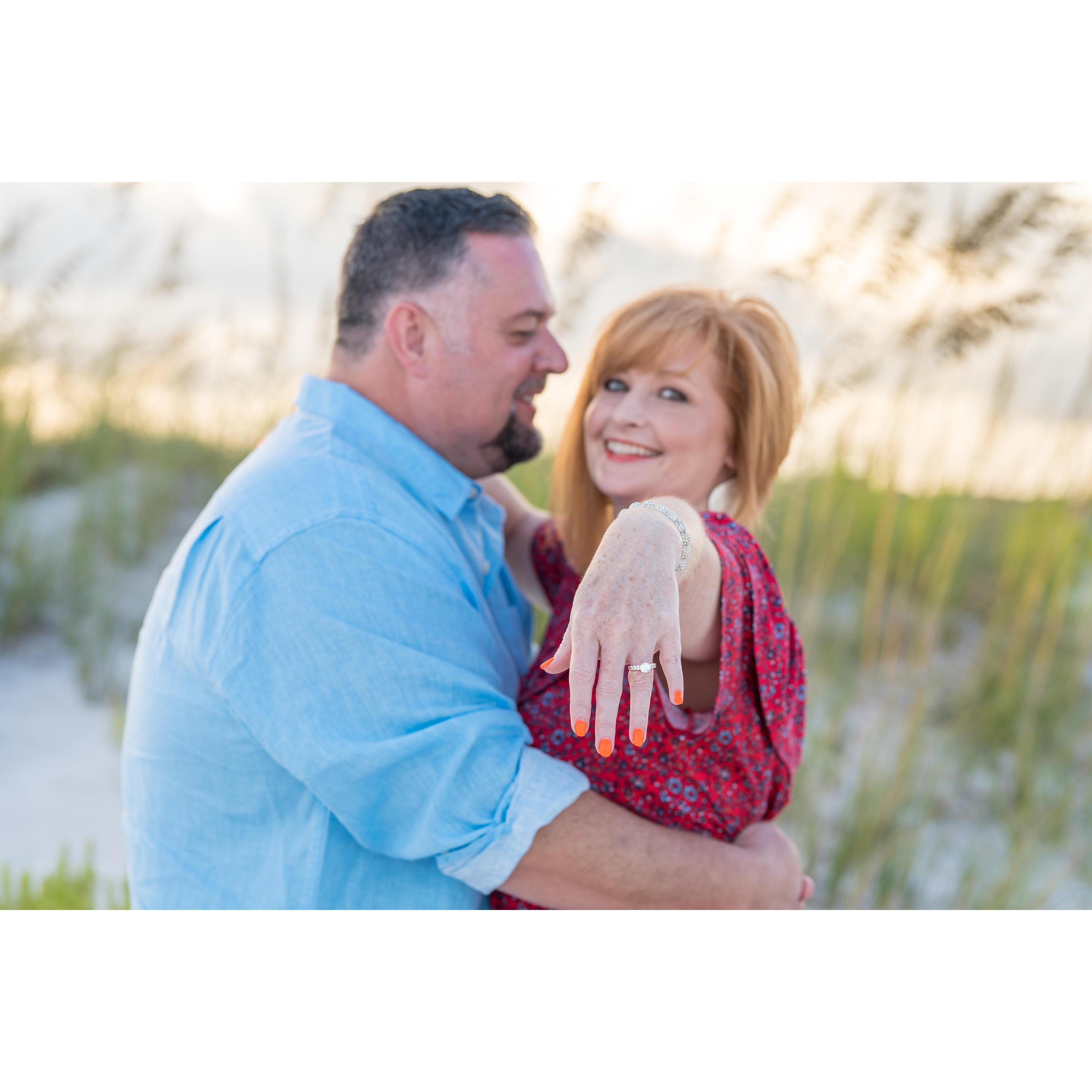 Proposed, with just a diamond. Chose the setting the next day and she had to wait 3 weeks without an engagement ring. Kristie called the jewelry store every other day for 3 weeks. True Story :)