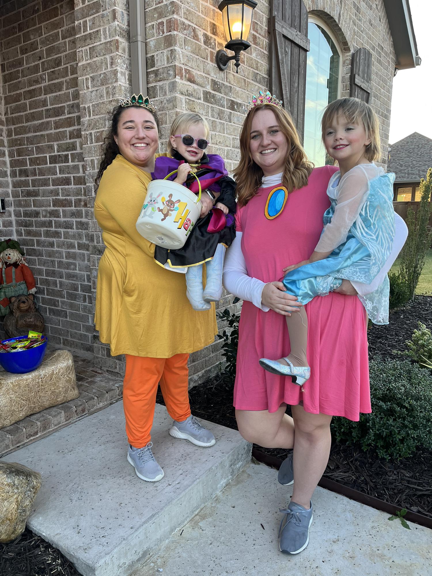 Kara, Bailey, and Kara’s nanny kids on Halloween in 2022