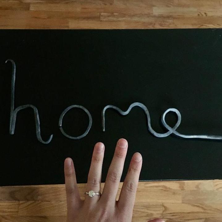 The 'home' sign Ethan forged and proposed with.