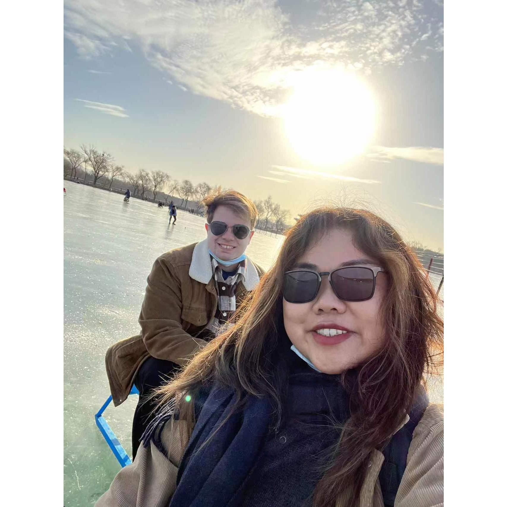 sledding on a frozen lake at the winter palace in Beijing