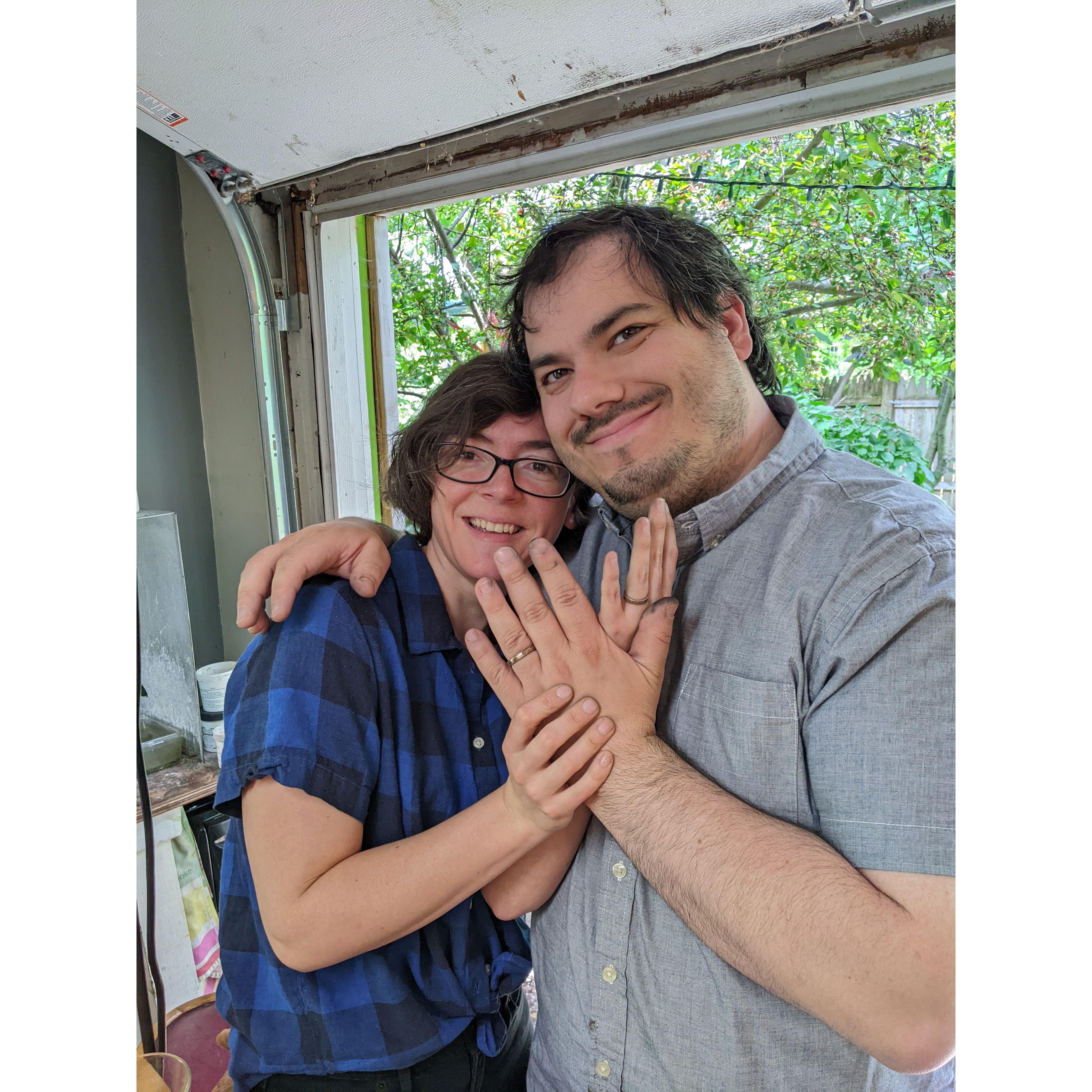 Trying the finished rings on. They're really comfortable, since we made them for our exact sizes.