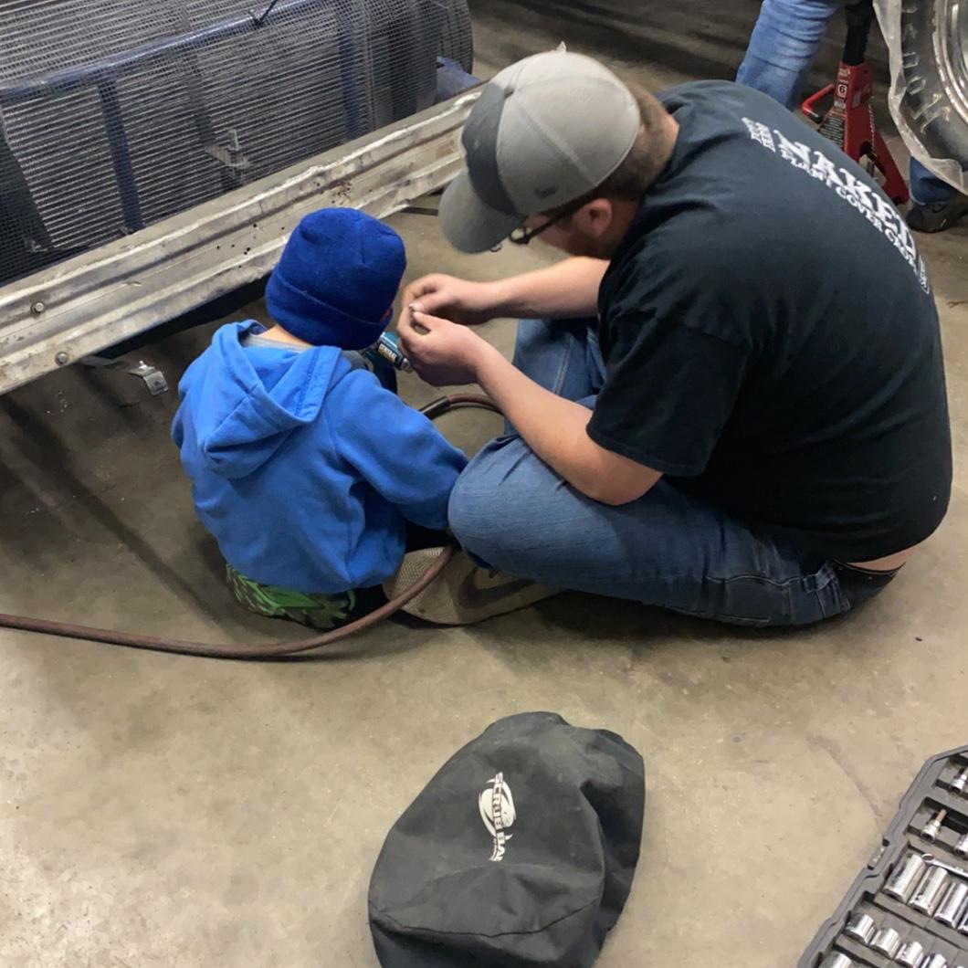 Jaxon’s first time working on the race car.
