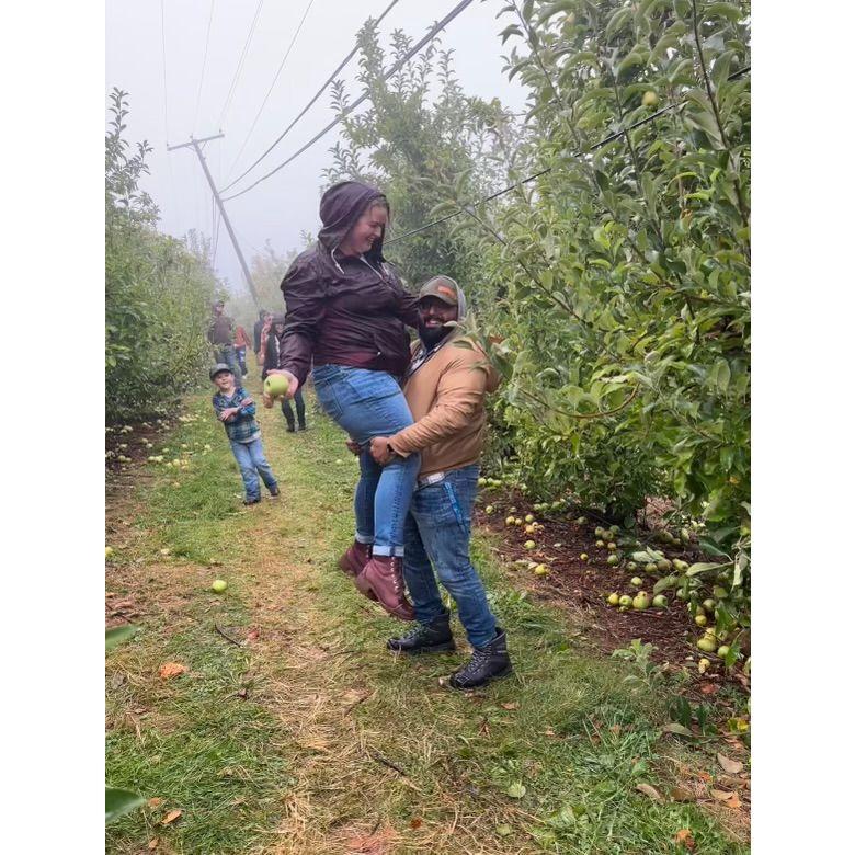 Sweet As Apple Pie... Rahum and Kelsey went Apple Picking. The apples were so high up that this was their strategy for grabbing them. They amused other apple pickers so much that this photo was taken.