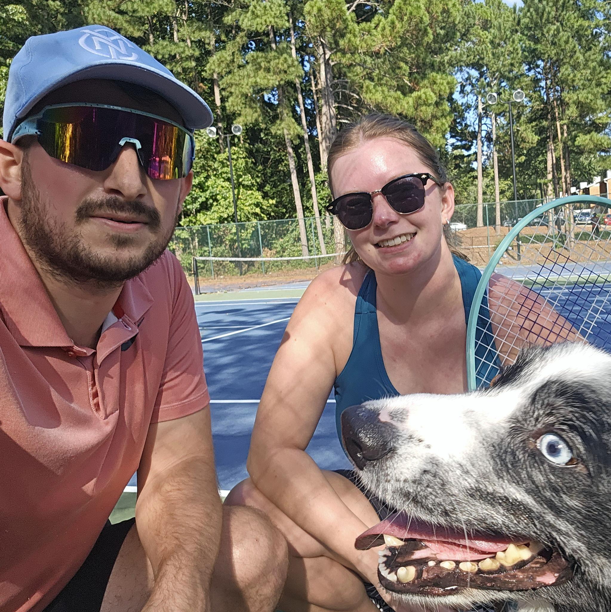 Playing tennis in our new Atlanta home with the best ball boy
