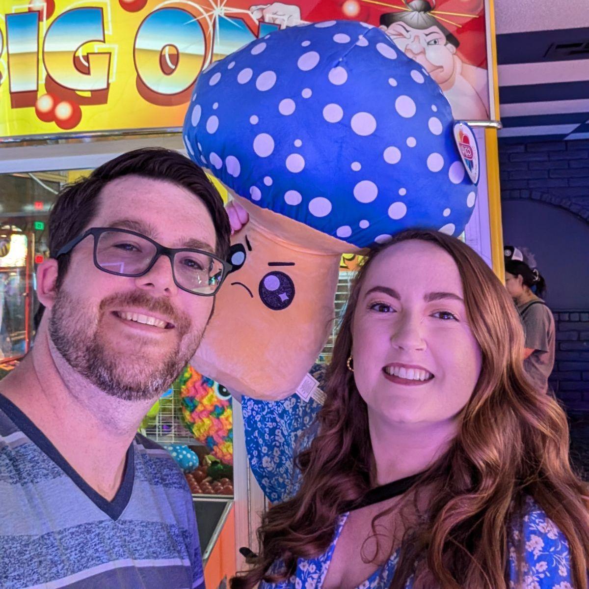 Fun fact: we took this picture on our first date at Golf n' Stuff. Josh won this mushroom plush!
