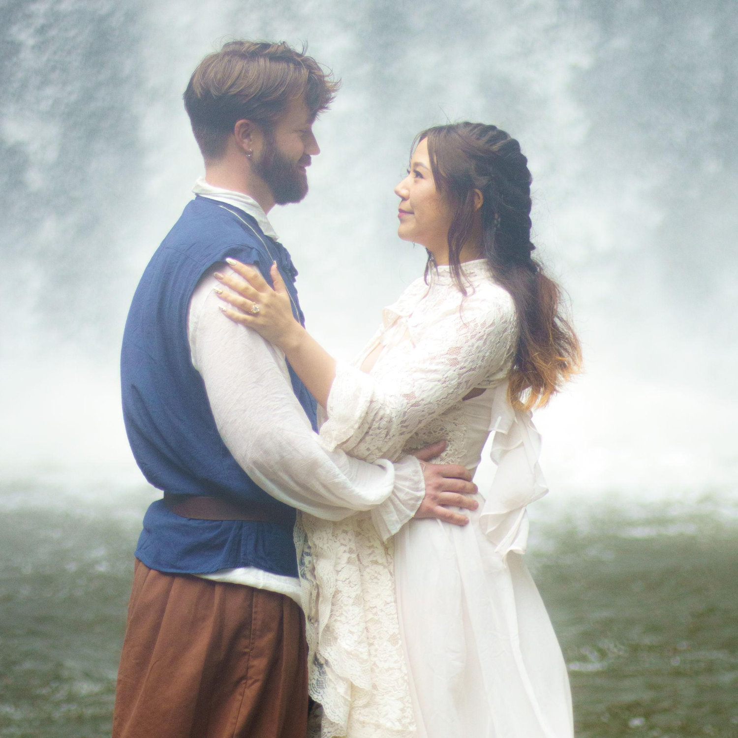 Our good friend Dan Burkard took our engagement photos at Looking Glass Falls one rainy afternoon. 
C. https://www.dbphotosandvideos.com/
https://www.instagram.com/dkbproductions