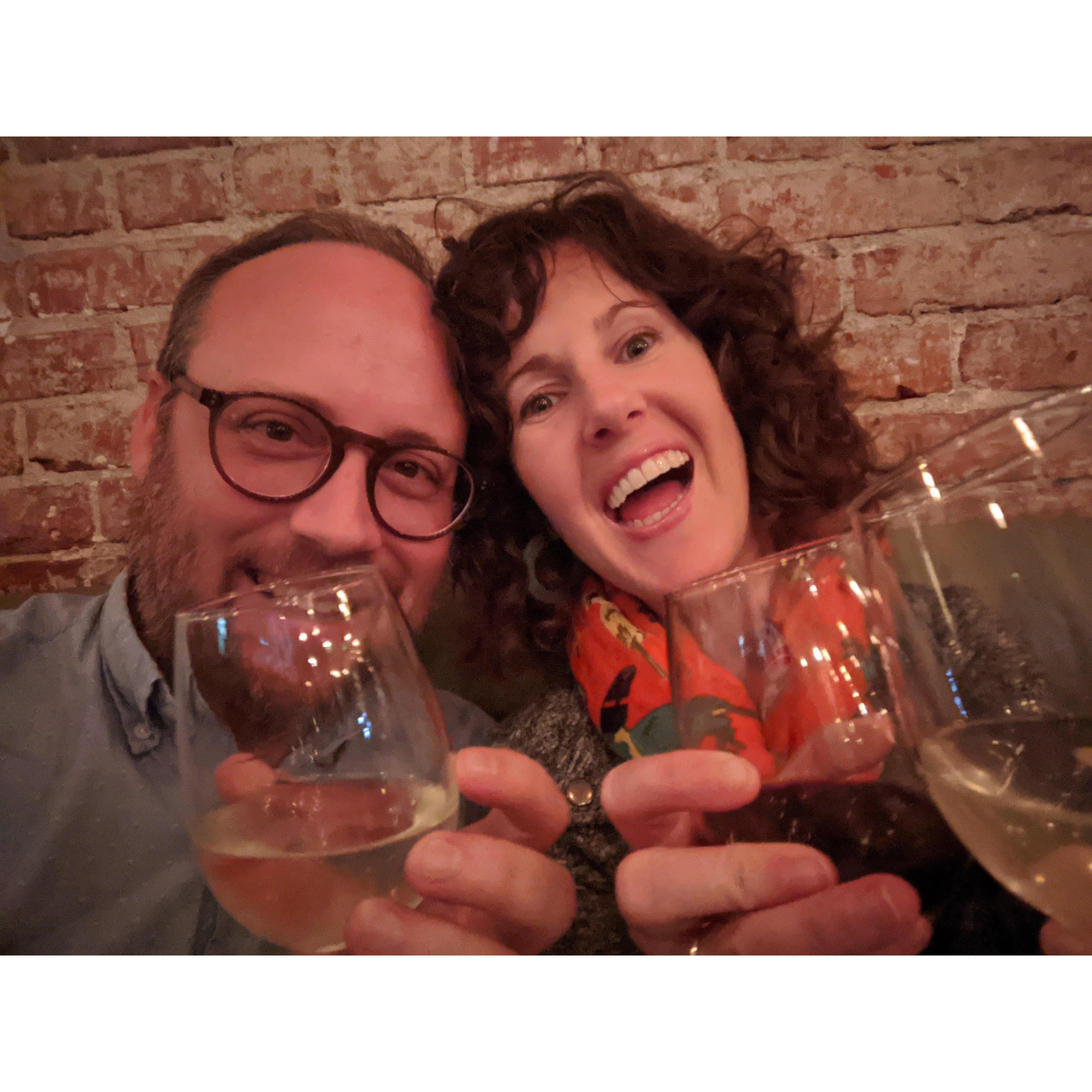 Sharing our first drinks as an engaged couple, which were paid for by the super kind people at the table sitting next to us!