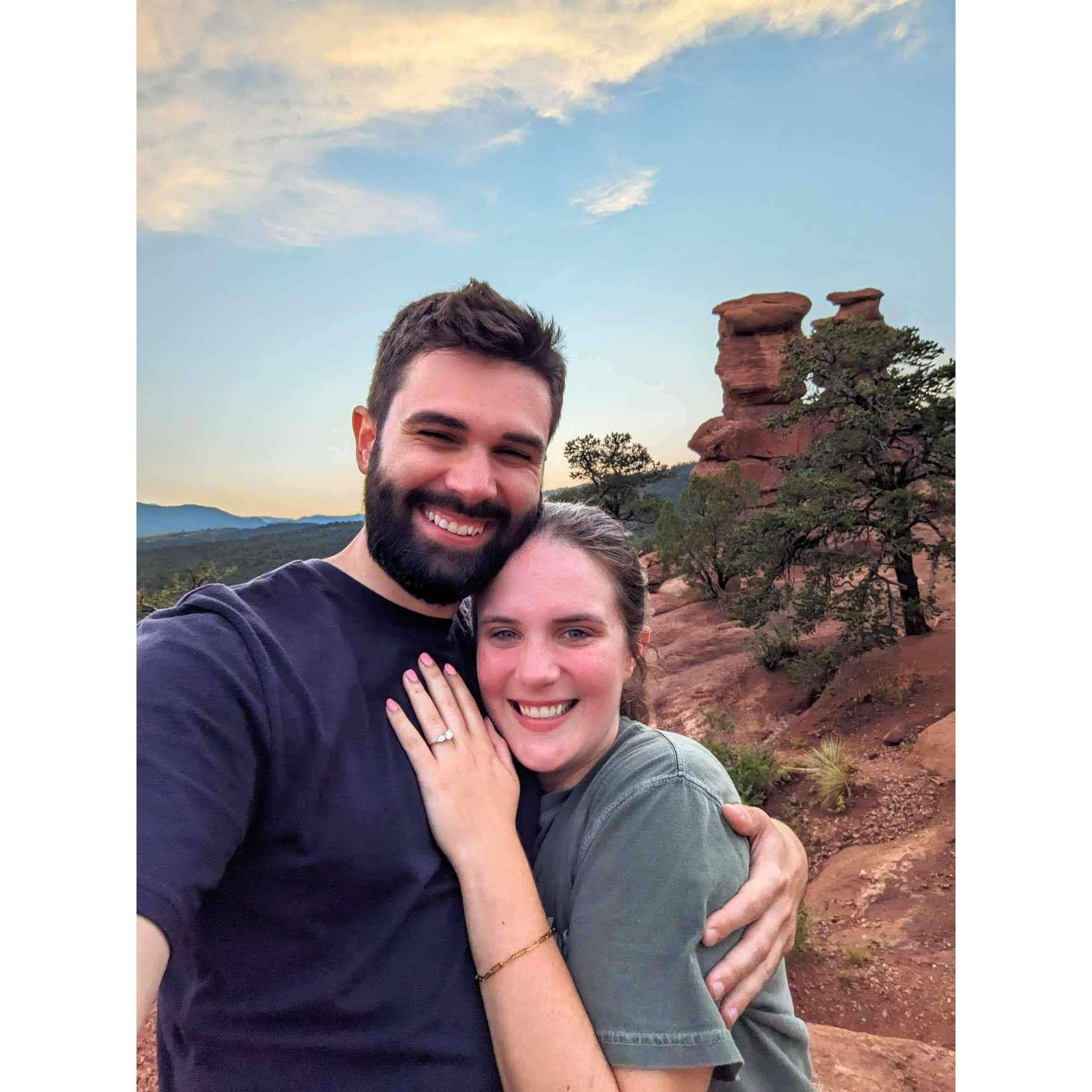 Josh had spent the week planning for the perfect proposal. He proposed on July 21, 2024, at the Siamese Twin rocks at the Garden of the Gods National Park.