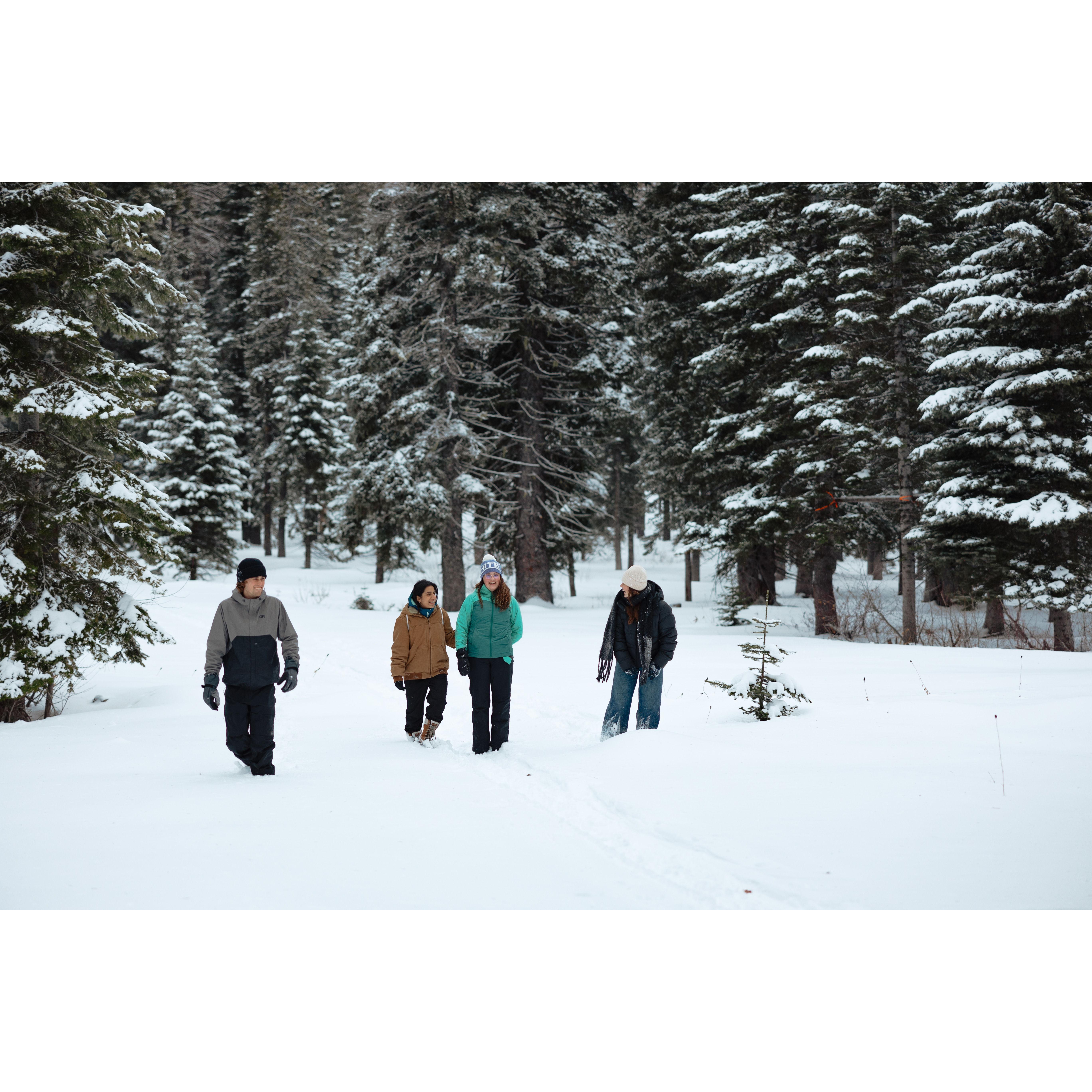Lorelei walking up, thinking she's going snowshoeing