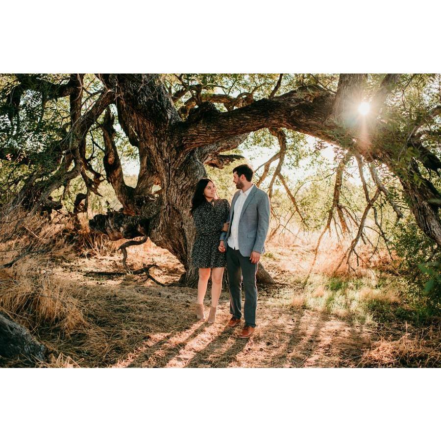May our love be as thriving as the tree behind us, ever-growing and strong.