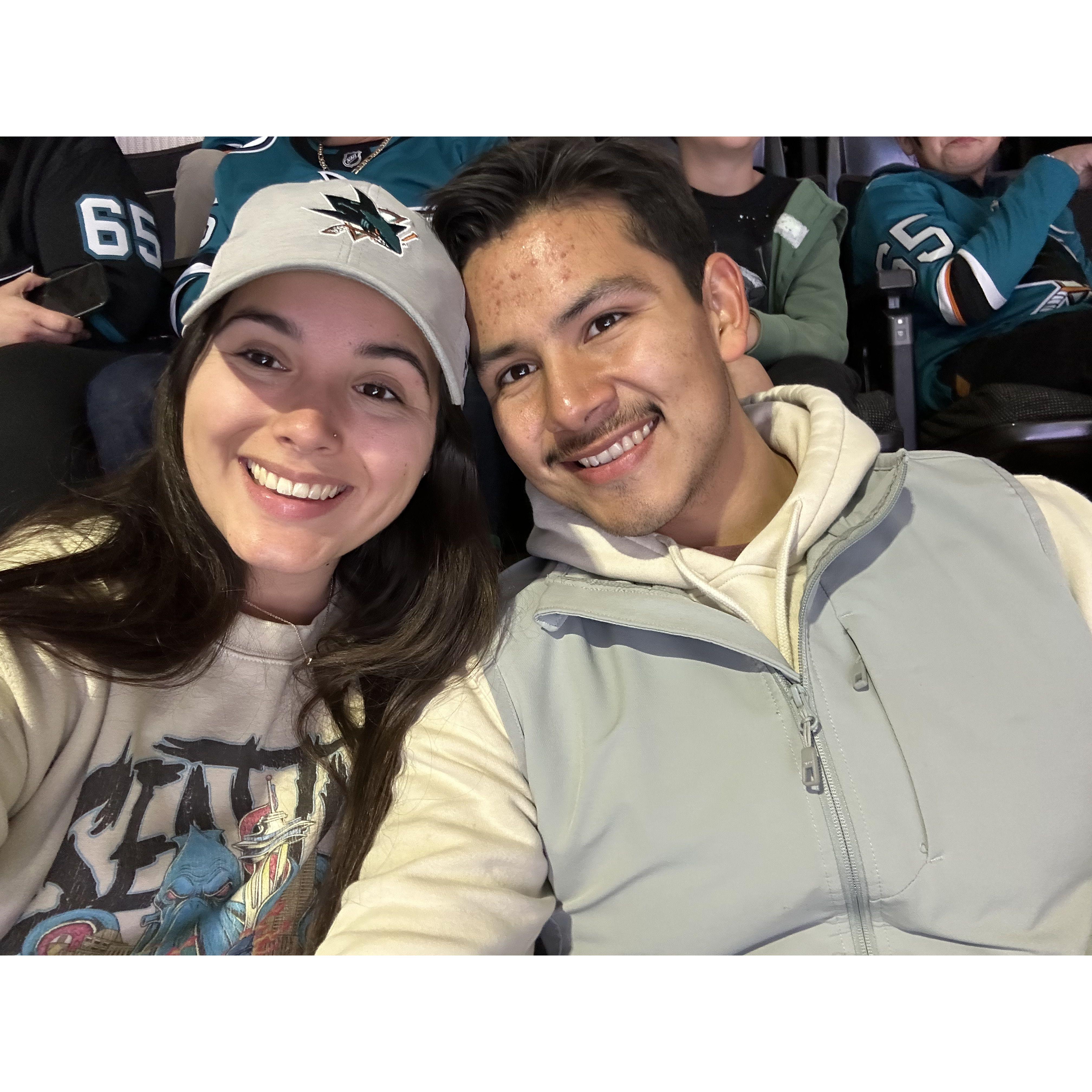 Our first hockey game being engaged!