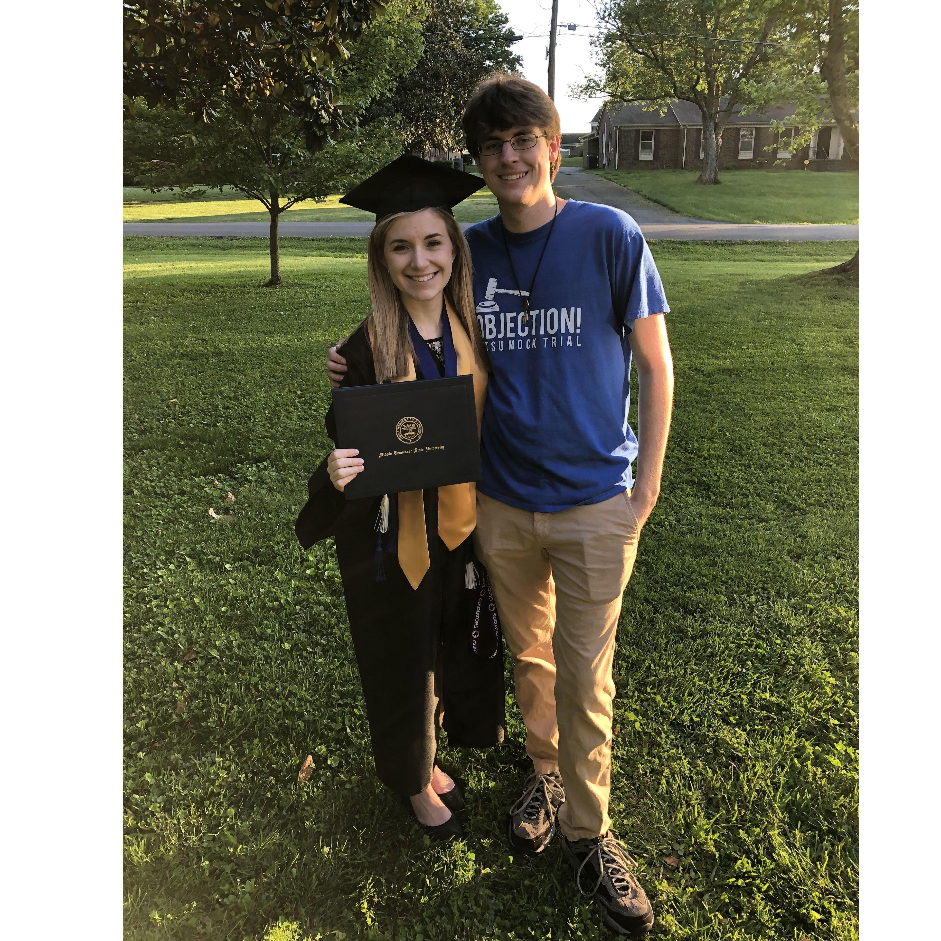 A persistent feature of our relationship has been supporting each other through academic challenges. We took this pic in May 2021 after Cate survived her Honors thesis, aided by Alex's love & support.
