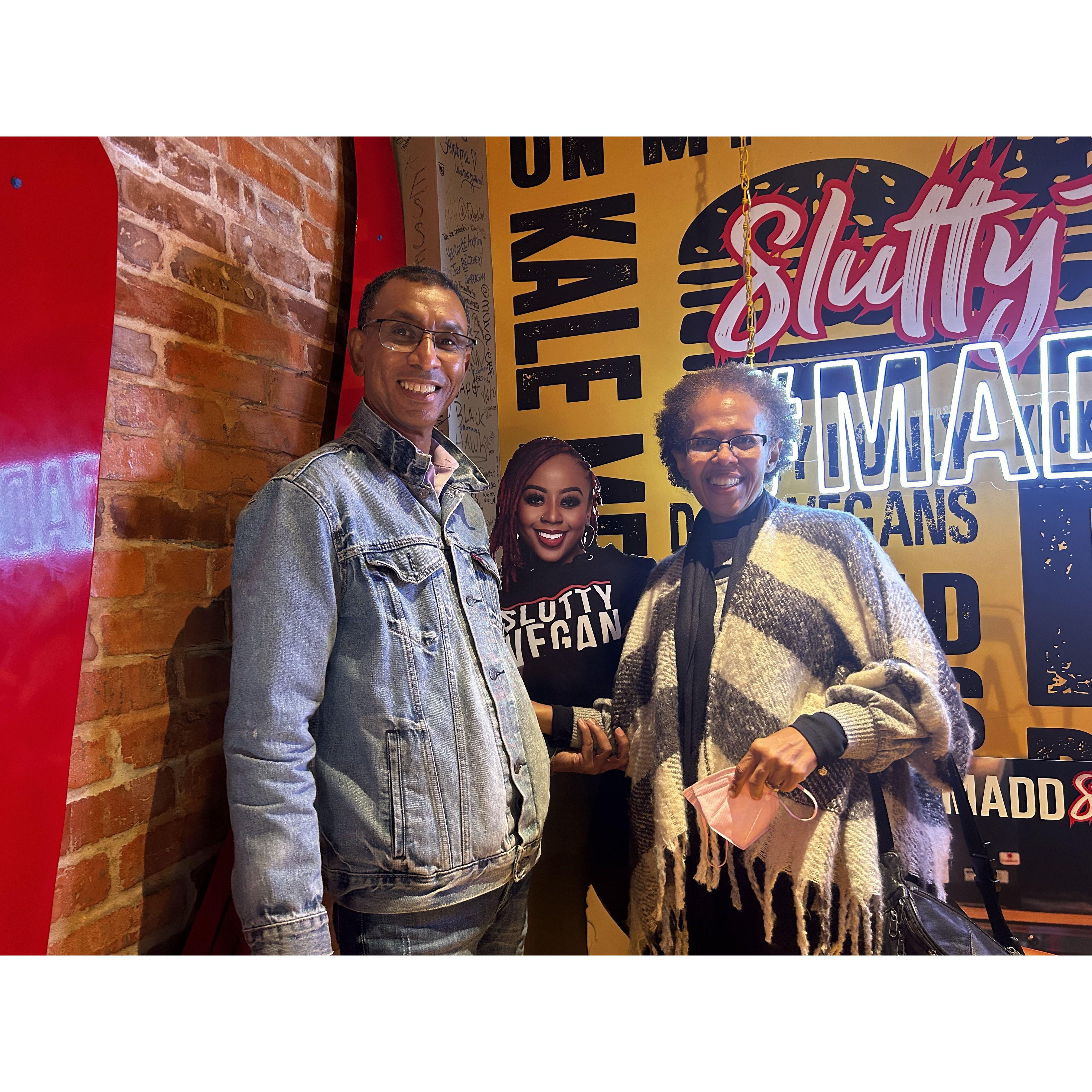 In ATL's Slutty Vegan with life-sized cutout of the restaurant chain's founder, Pinky Cole.