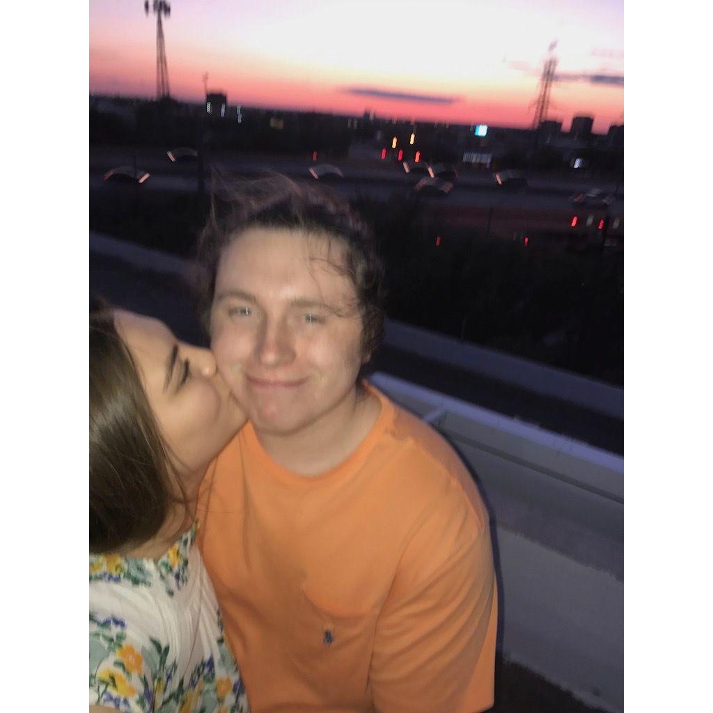 Sunsets and kisses but on a Dallas rooftop.