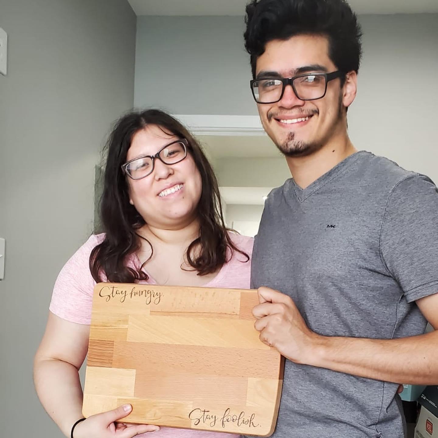 A picture with a gift from a friend that they got when they moved into their first apartment back in October 2020.