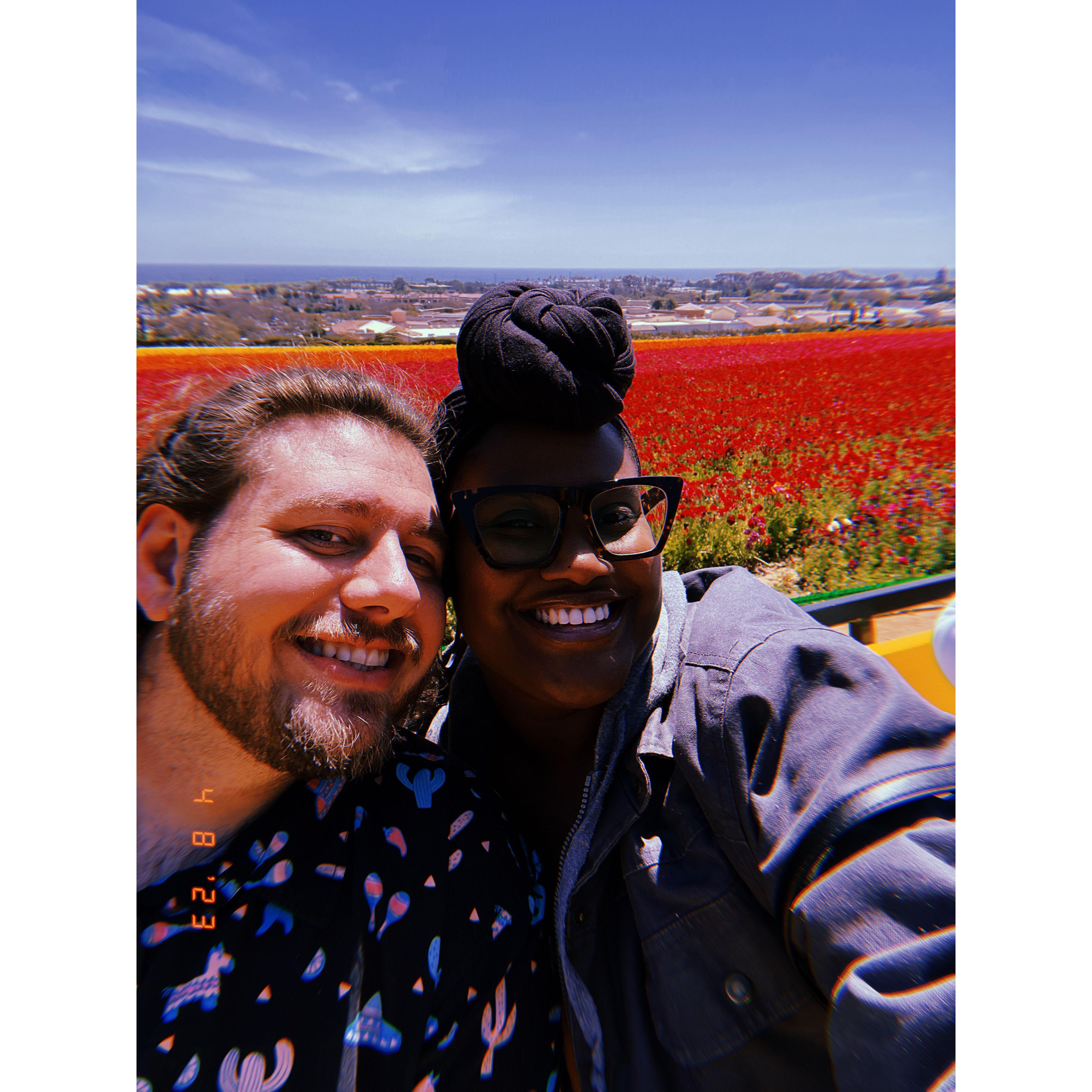 Celebrating our first anniversary together at the Carlsbad Flower Fields❤️
