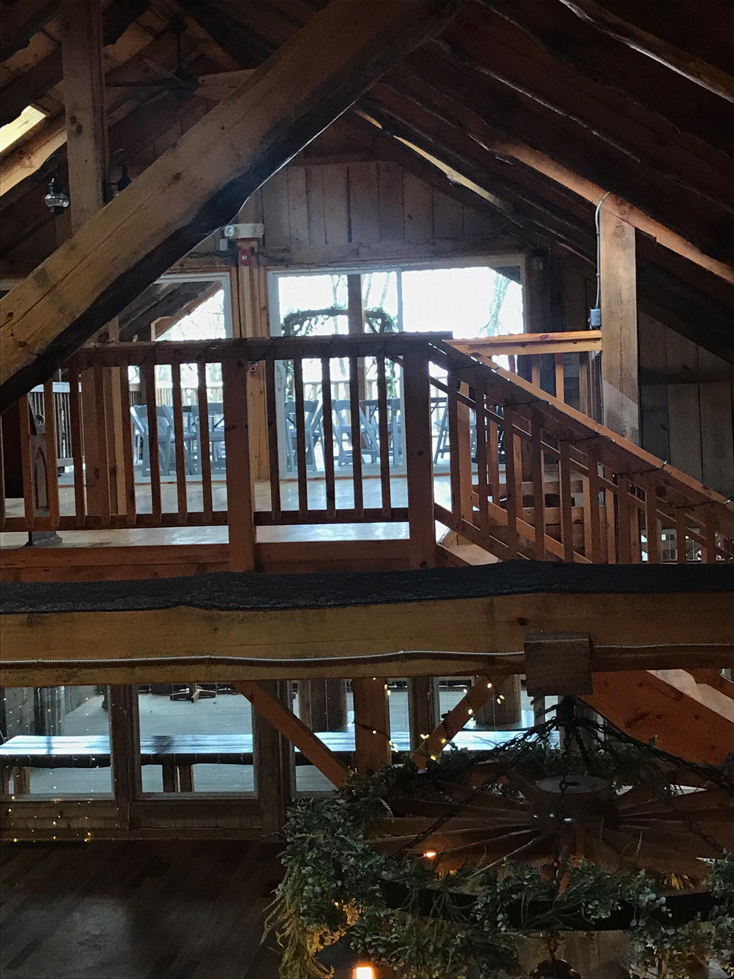 View of the loft on the top level of the barn. This area has doors which lift up to create a deck that over looks the ceremony space. It doubles as a ceremony space in bad weather.