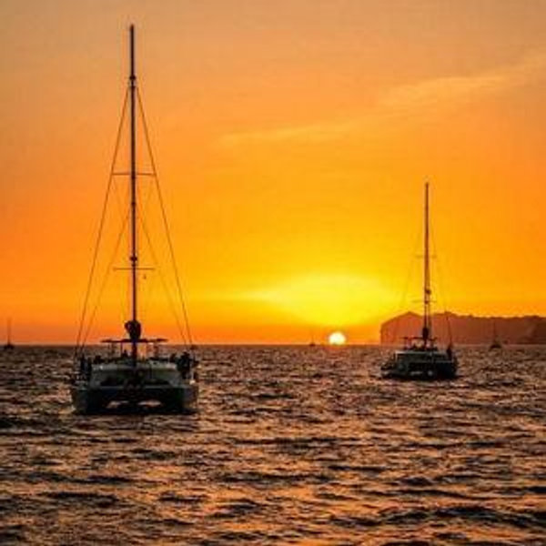 Sunset catamaran cruise to view the Santorini Caldera