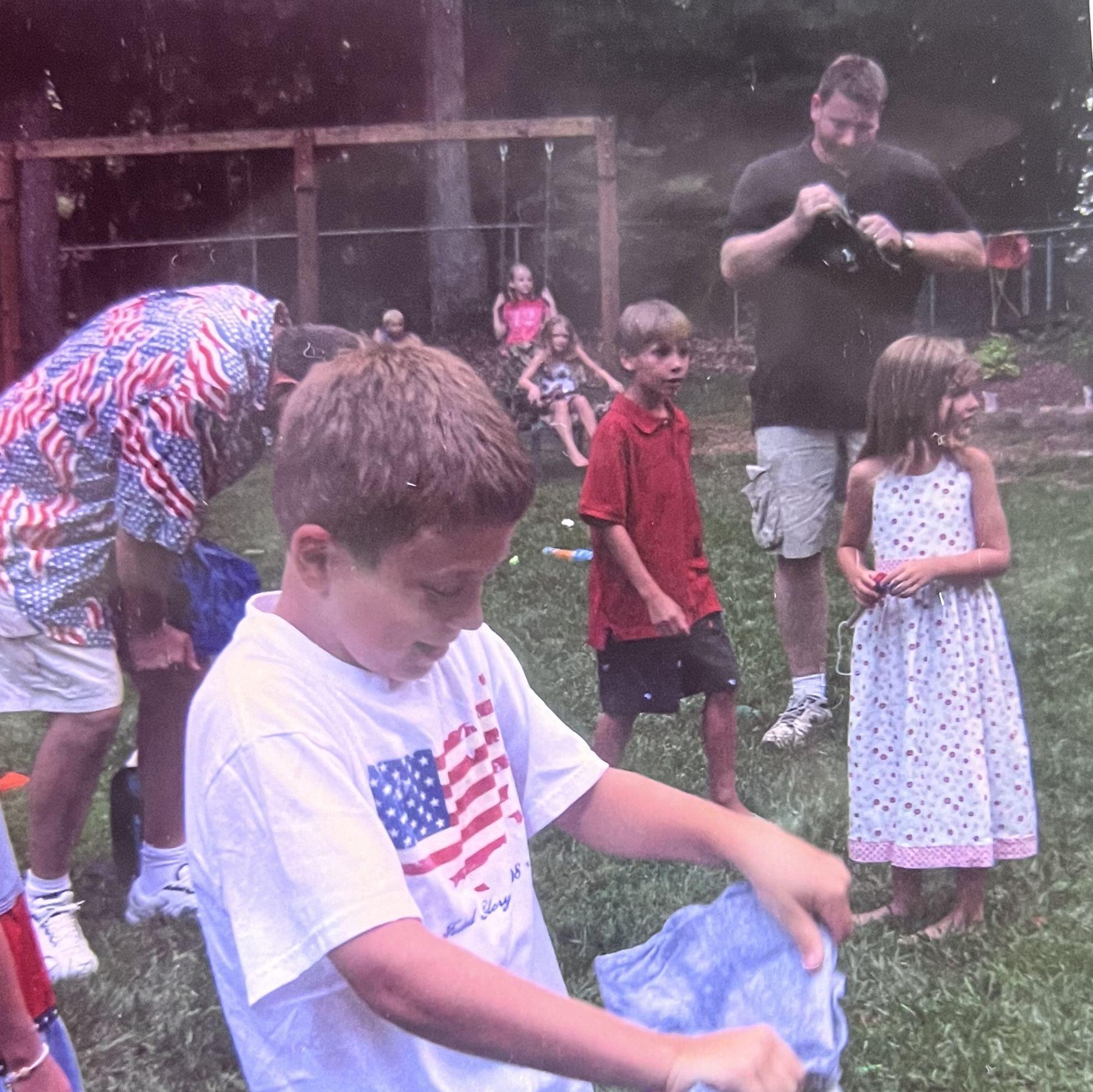 Ben with his future father in law in the background, competing in the frozen t-shirt contest.