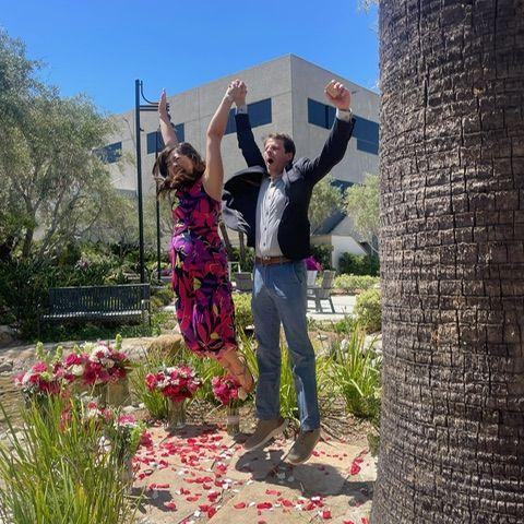 Candid jump for joy after the proposal!