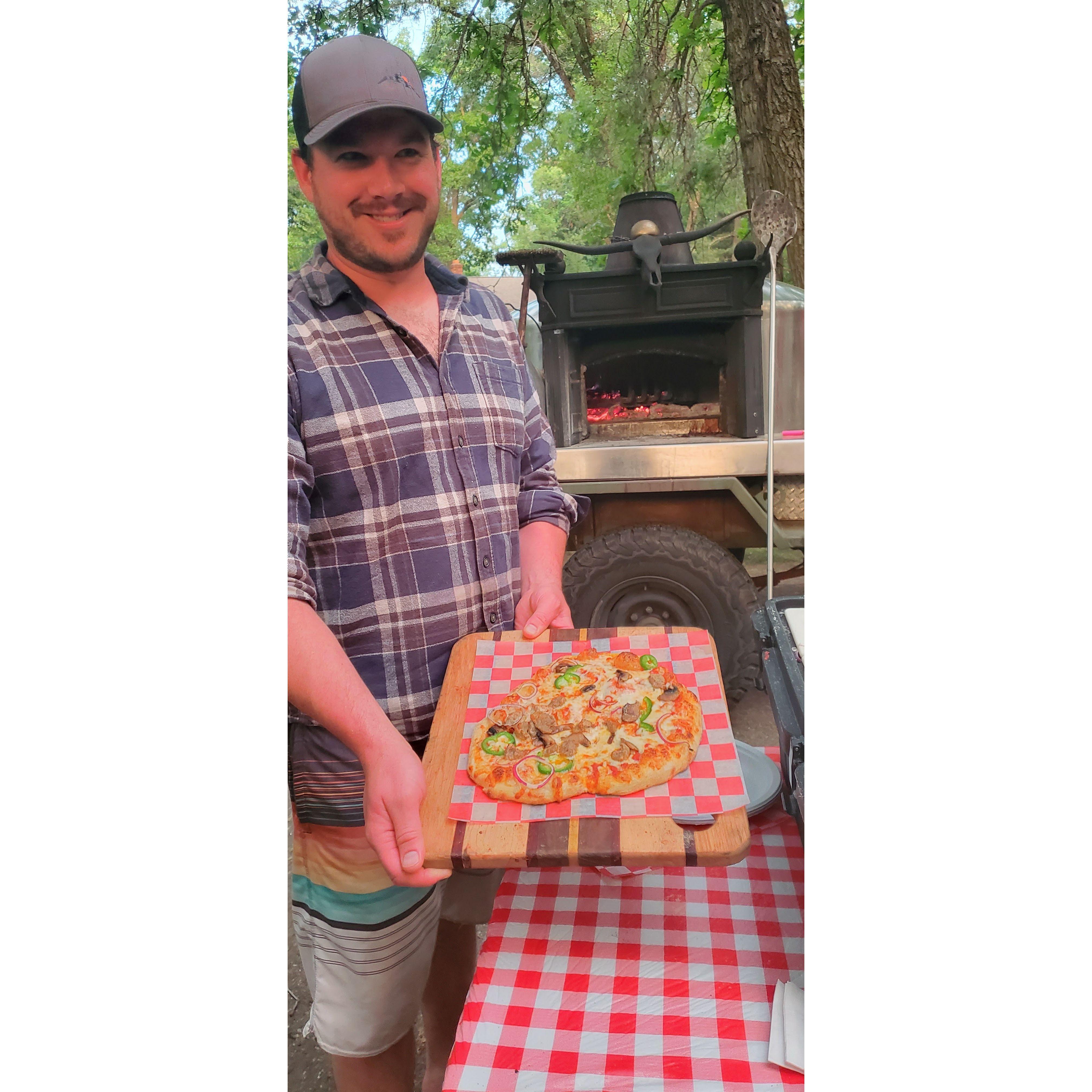 June 2023: Evan is showing off his first woodfired pizza