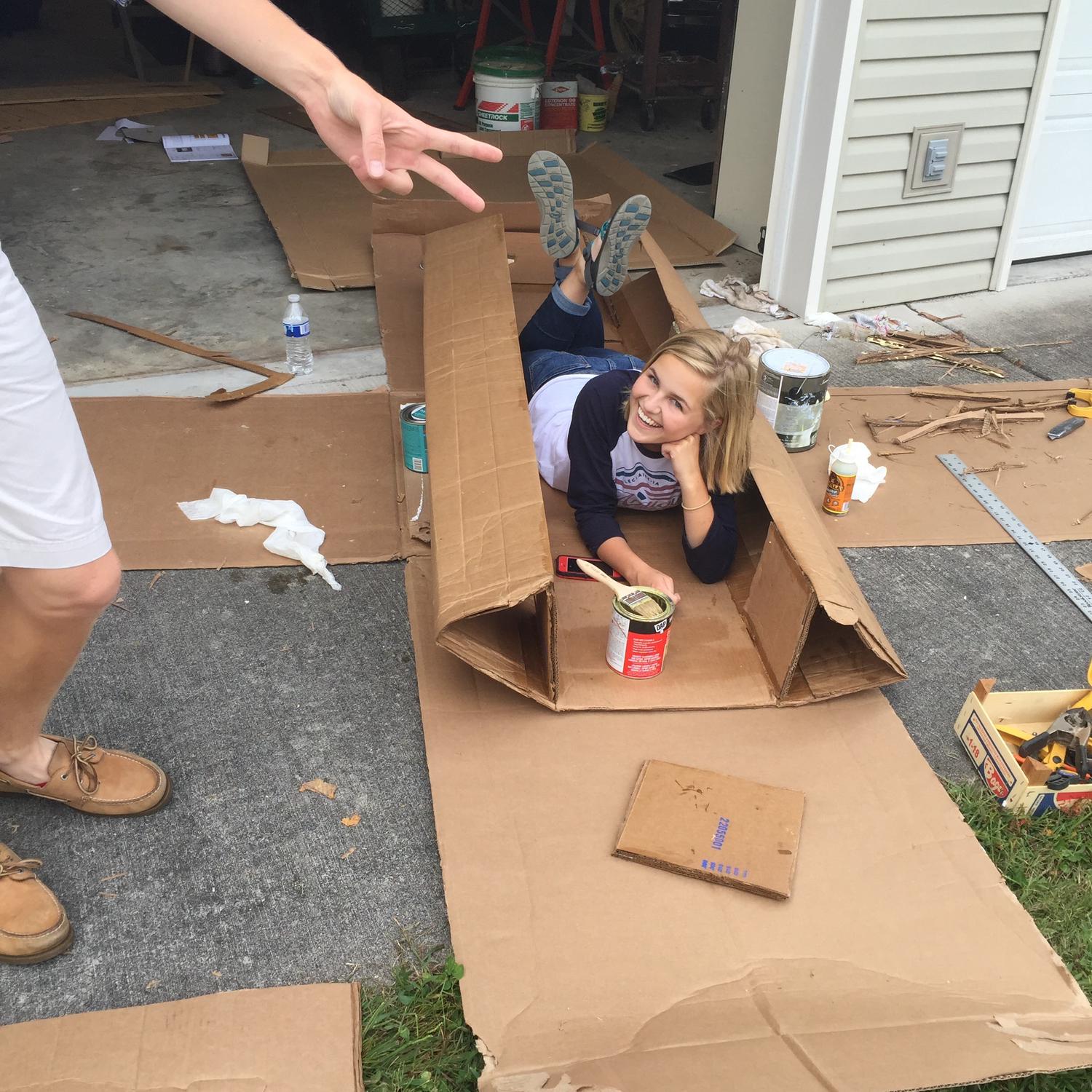 Building a cardboard boat together for engineering class. September 2015.