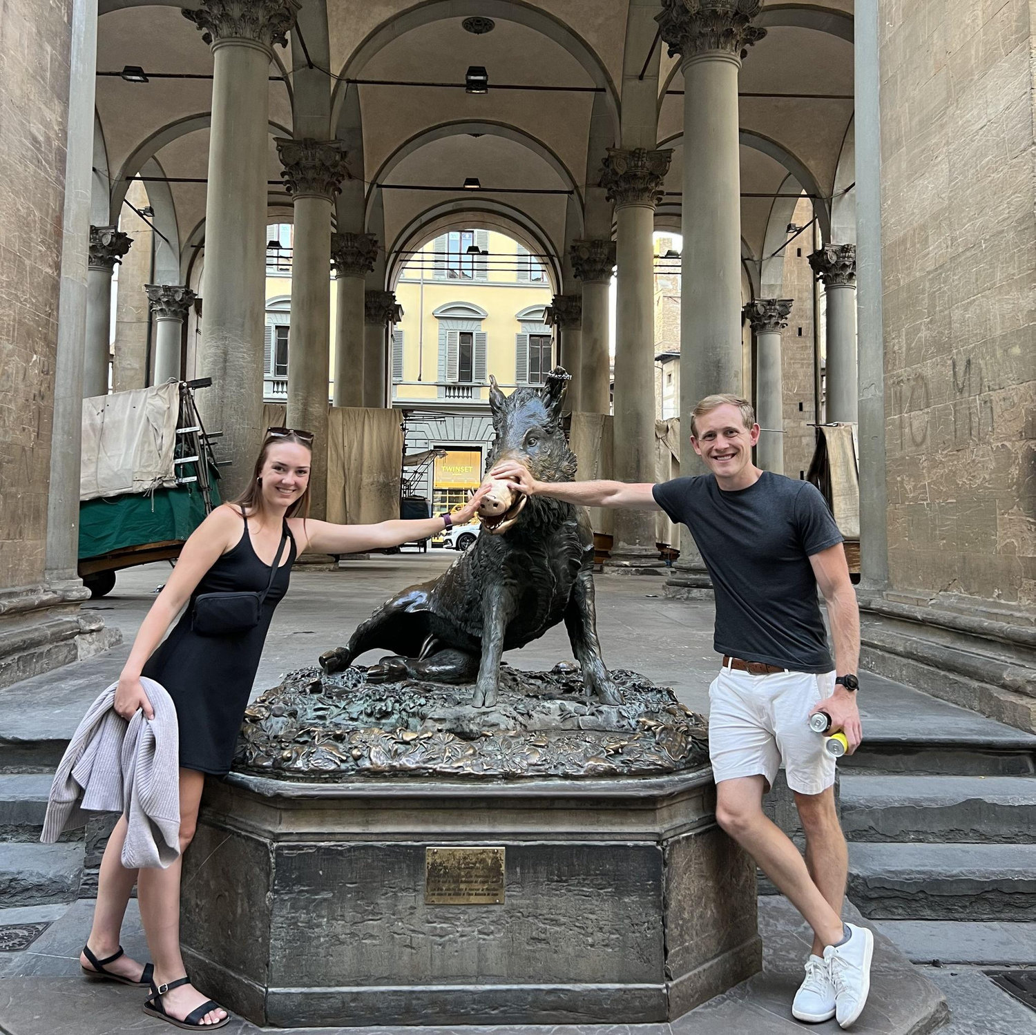 Rubbing the boar's nose for good luck in Florence, Italy, June 2023.