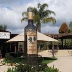 Pose with the giant wine bottle at Wilson Creek Winery