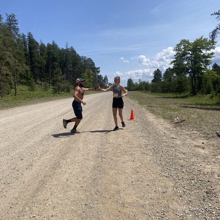 Tagging each other at the Great Lakes Relay in the U.P.