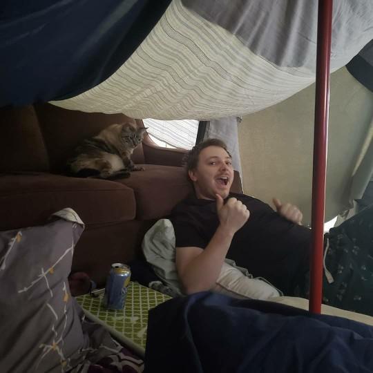 Matt in our living room fort with his cat Fish joining us.