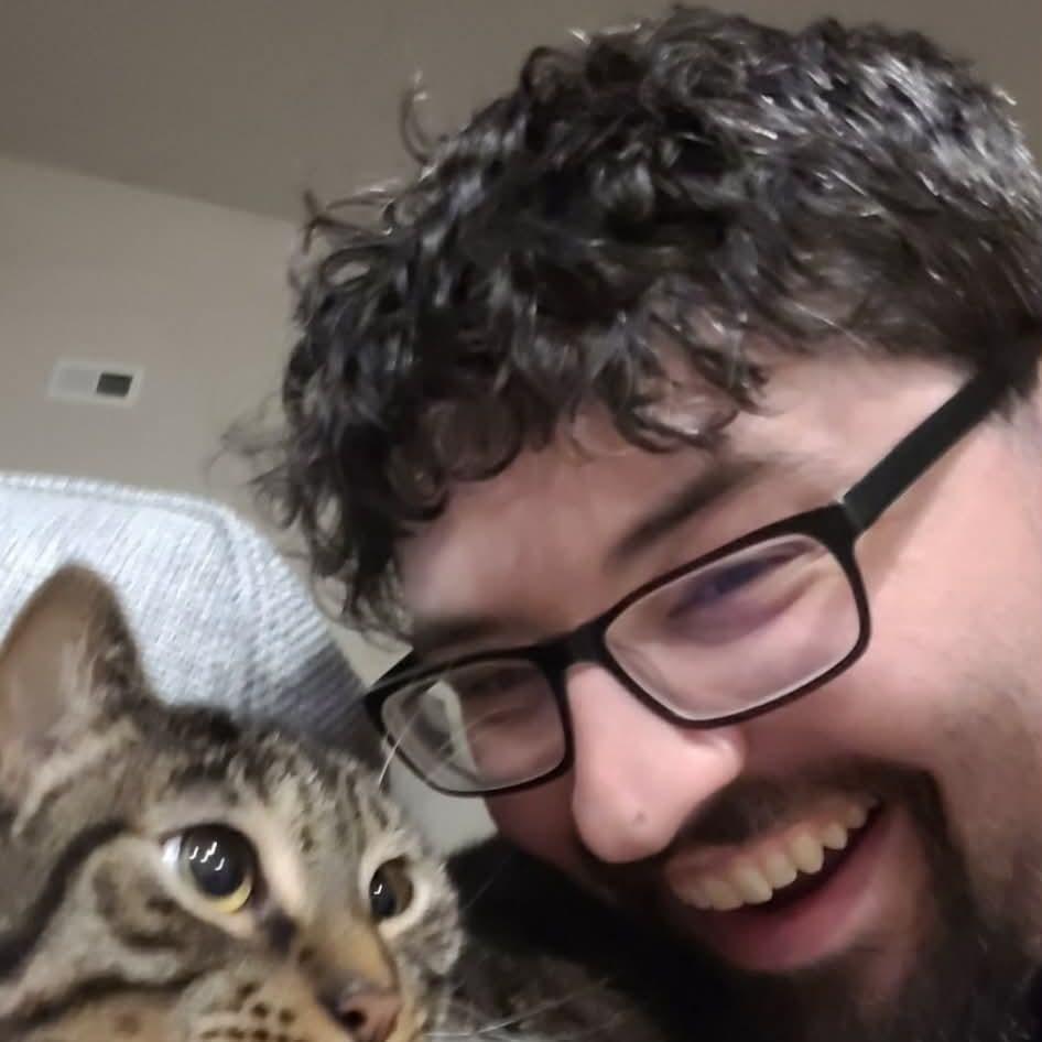 Joe attempting to befriend Lauren's fur baby, Clark.