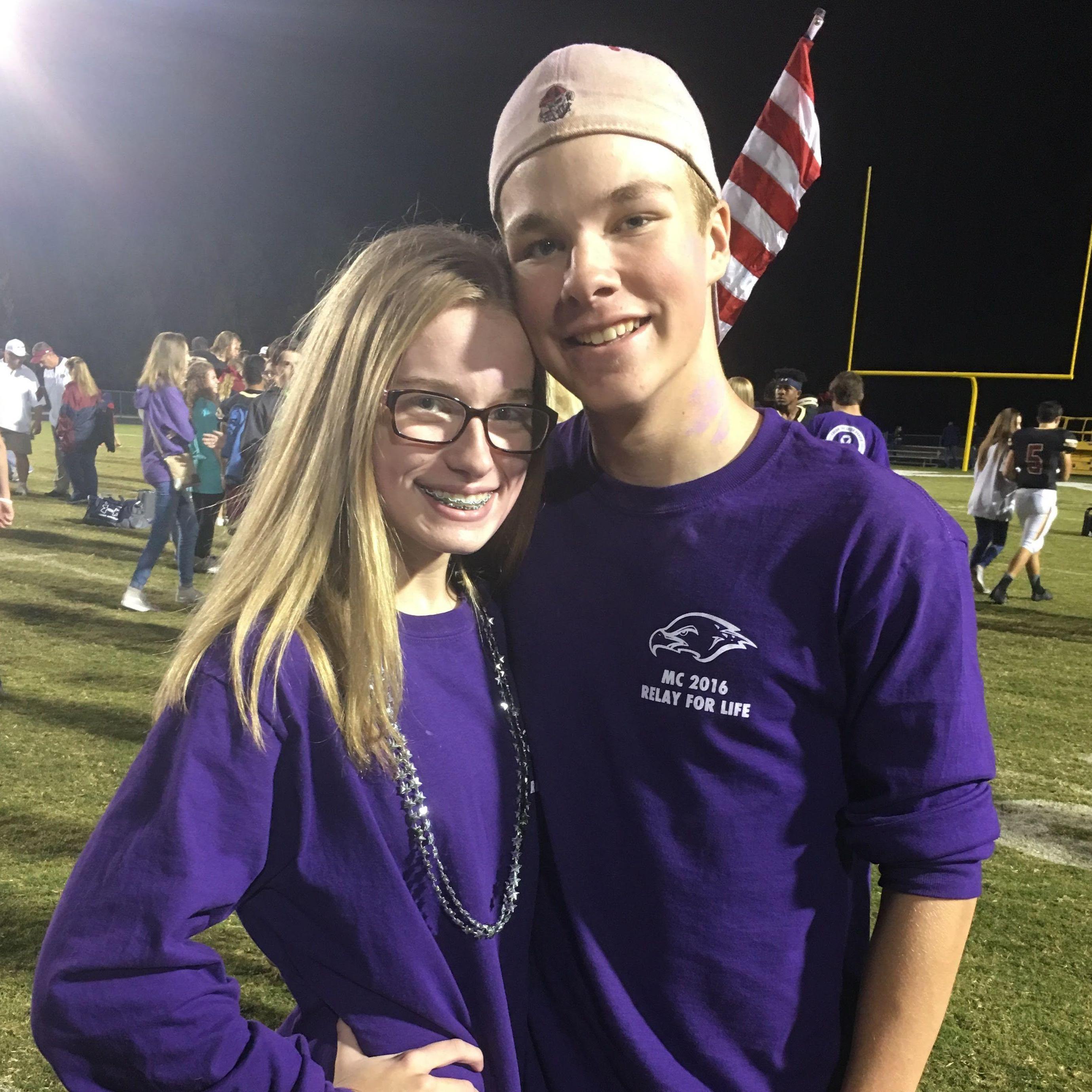 Our first photo together at a football game after we started dating!