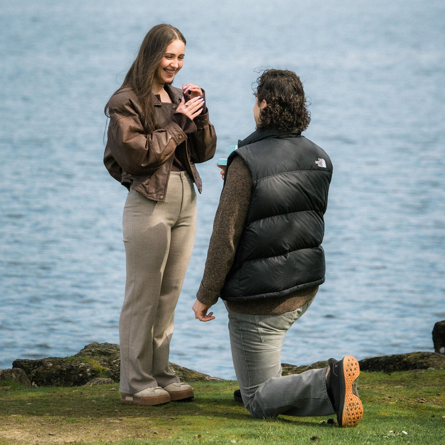 On a warm afternoon overlooking Union Bay in Seattle, he got down on one knee. With a few friends hidden in the bushes, flowers in hand, capturing every moment. It was an absolutely perfect surprise.