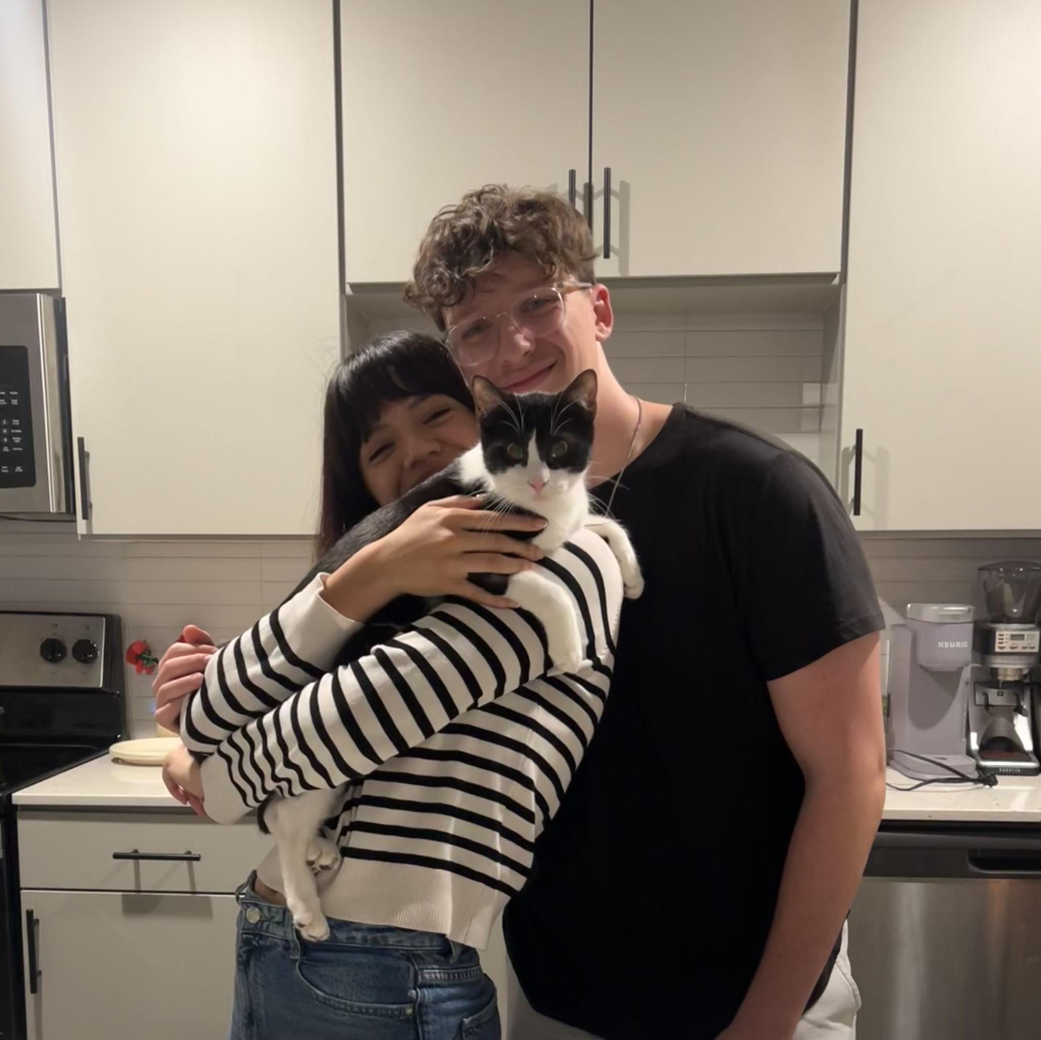 Here they are celebrating their cat's (Atlas) first birthday! They threw him a party with all of their close friends!