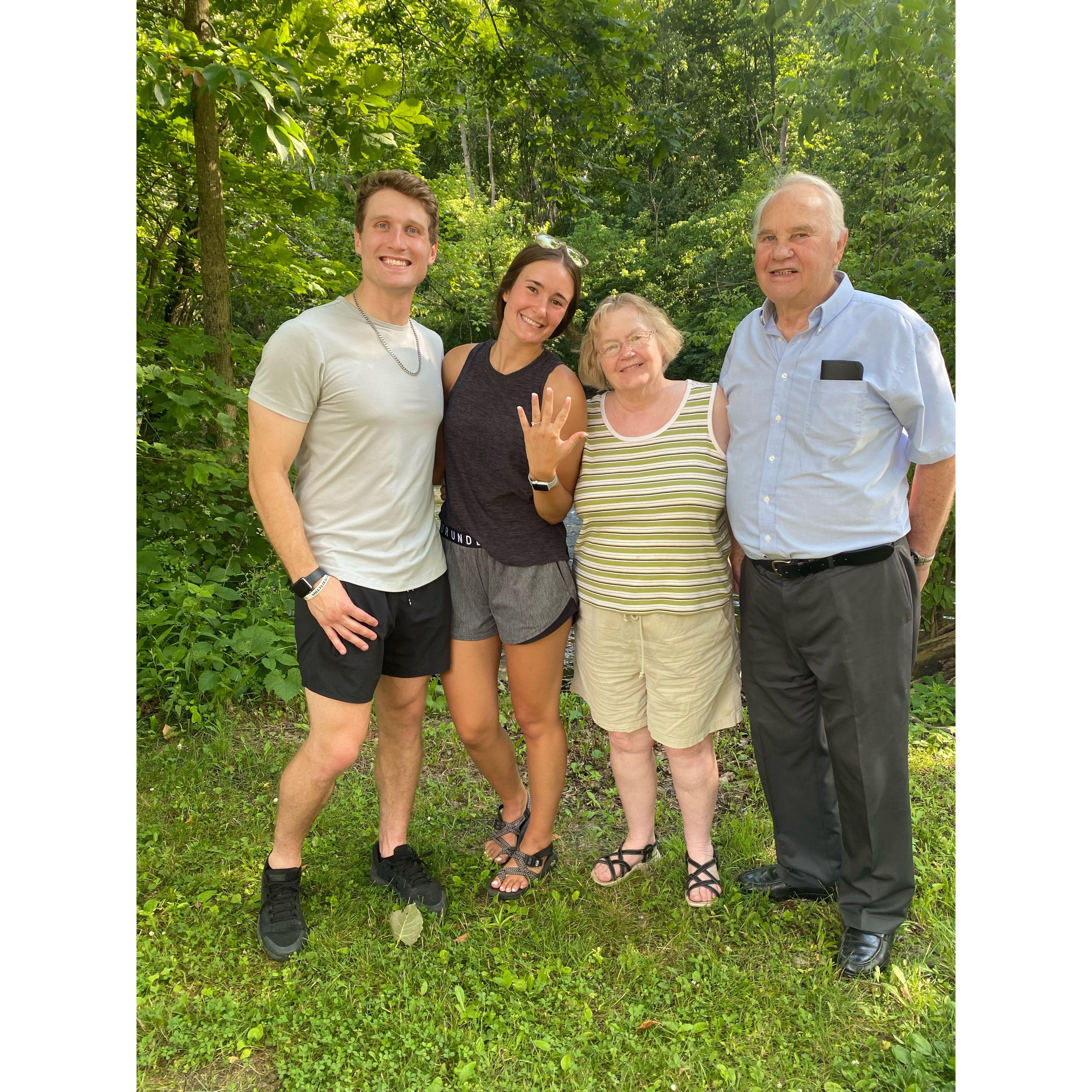 Post-proposal at Mohican State Park, pictured with Grandma Nancy and Grandpa Ray Bond. July, 2023.