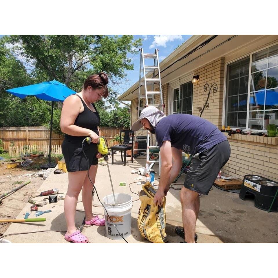This was taken after Sarah got concrete all over herself and the surrounding area and had to change clothes. We were pouring concrete footings for our patio cover.