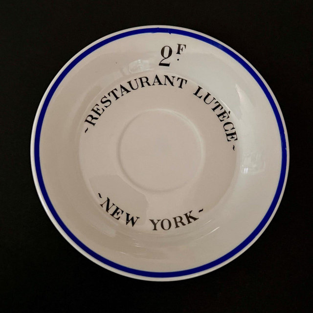 A rare tip plate from Restaurant Lucete, a famous French restaurant formerly located in New York City.