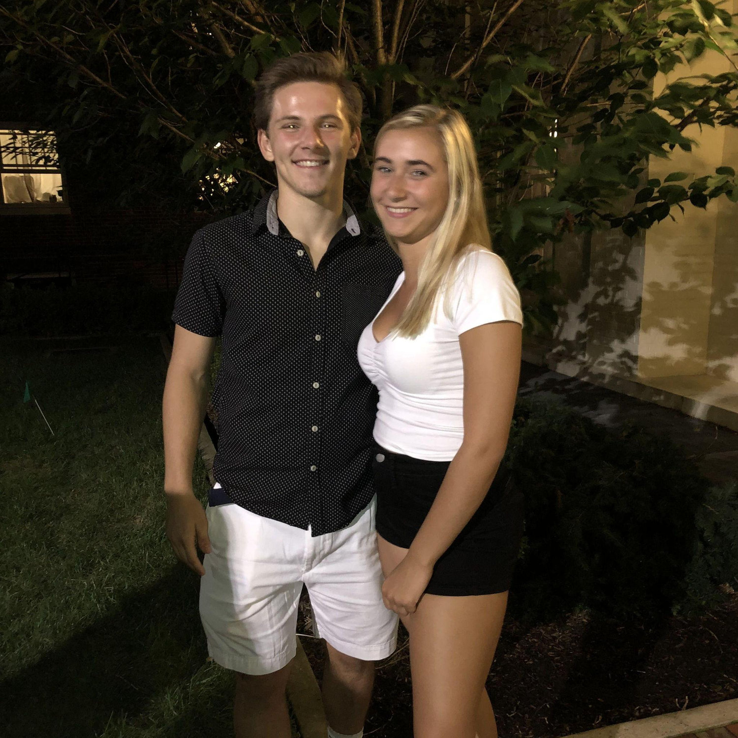 Our first picture outside our dorm, Atherton Hall at PSU during the first week of freshman year in 2019. We laugh that this is a foreshadow of our wedding of Pat in black and Erica in white