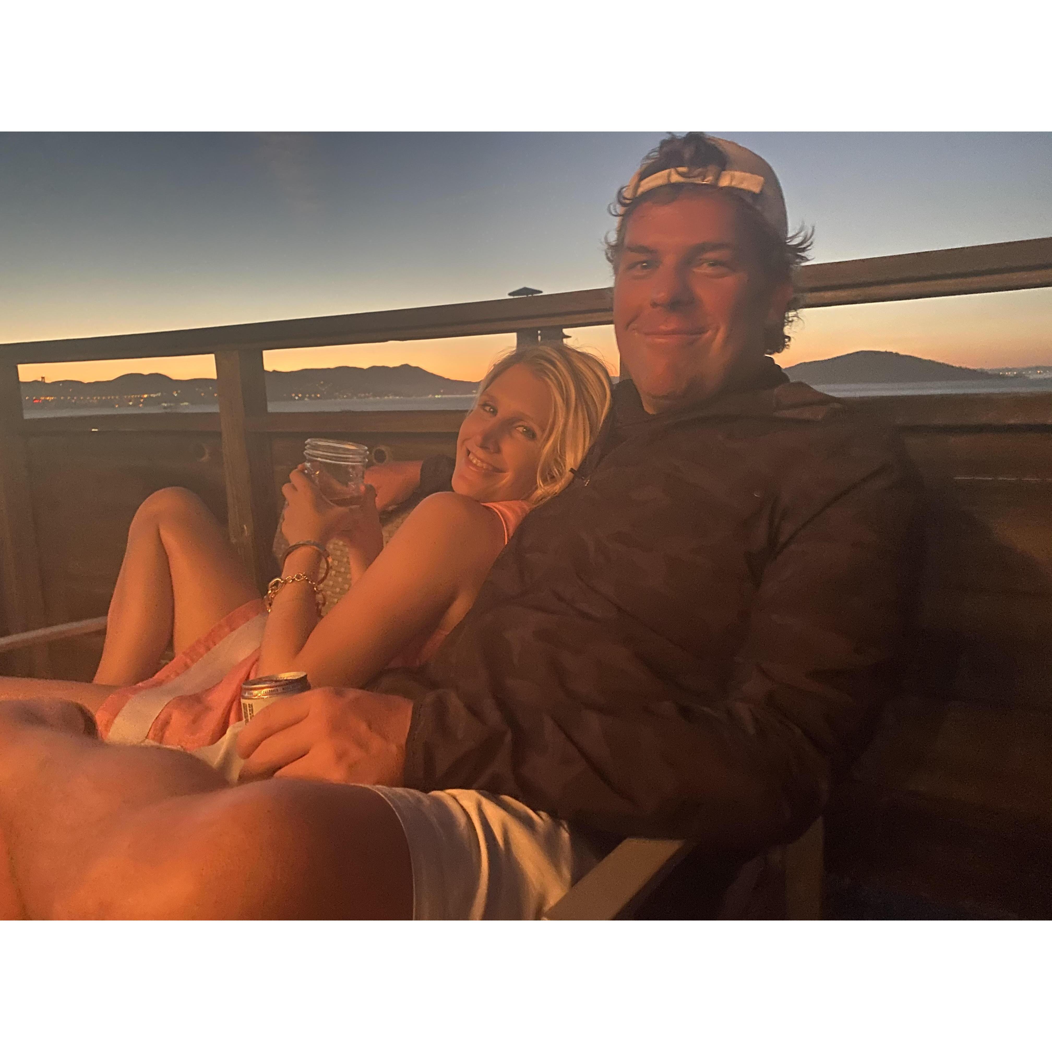 Gretchen watches the sunset while Mark looks for planes