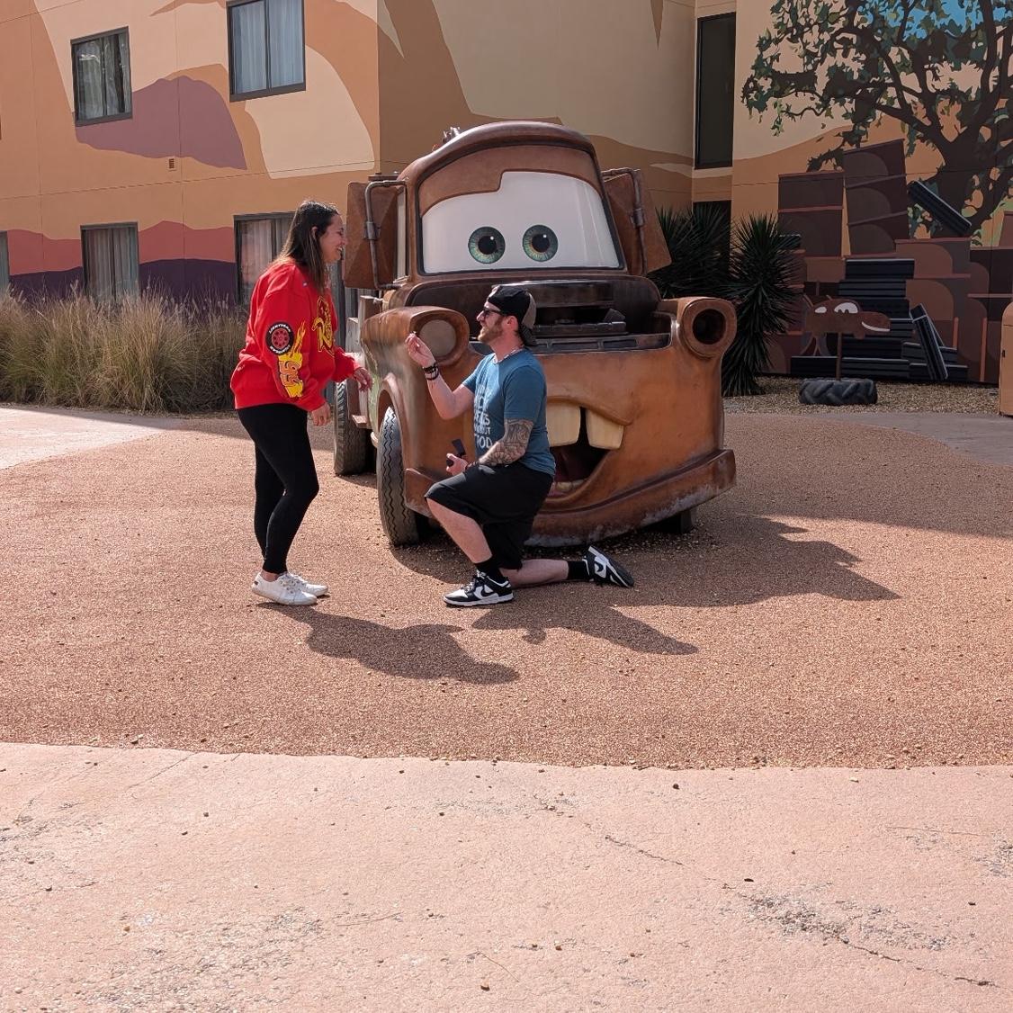 engaged in front of Mater! 2.12.26