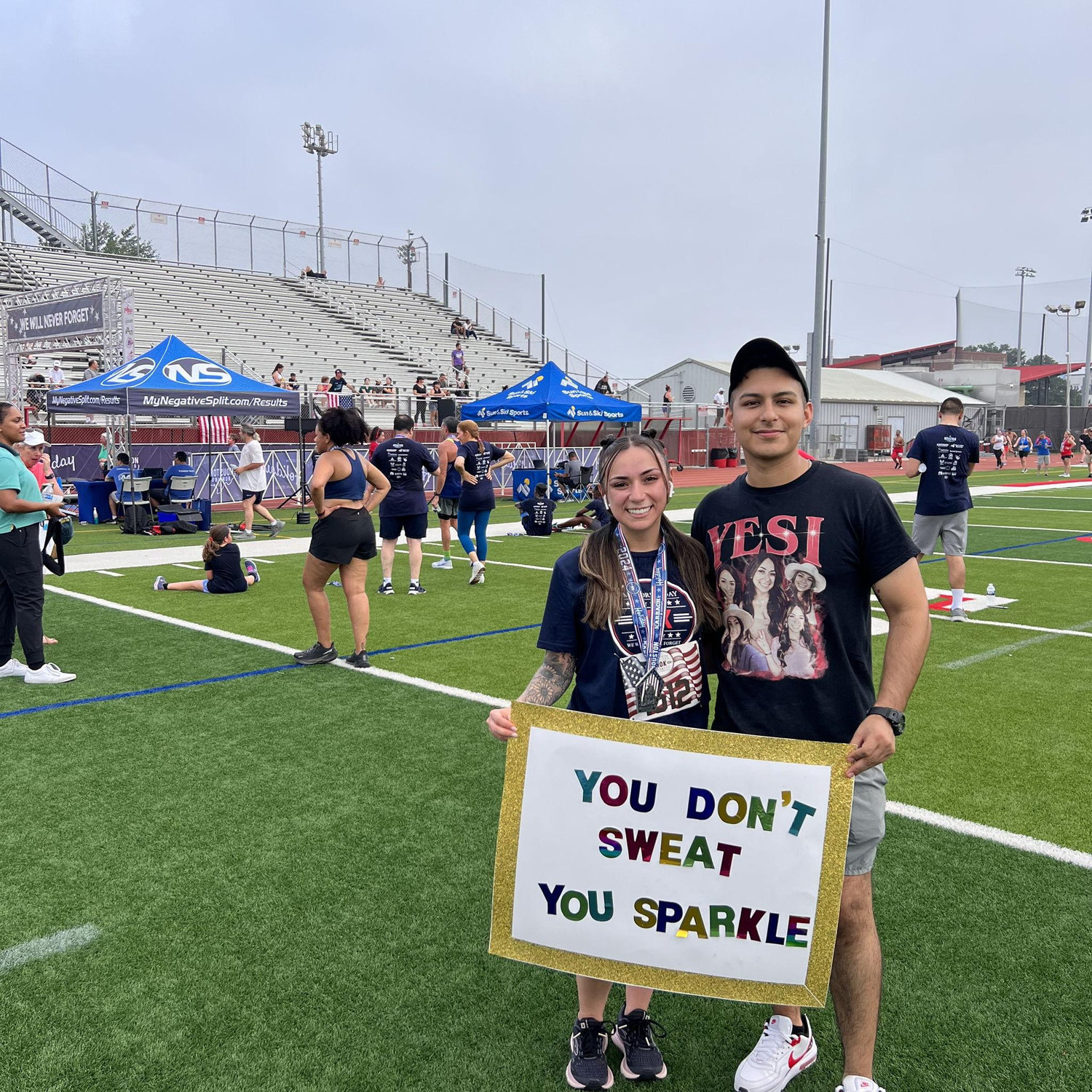 Abraham cheering on Yesi at her 5K!