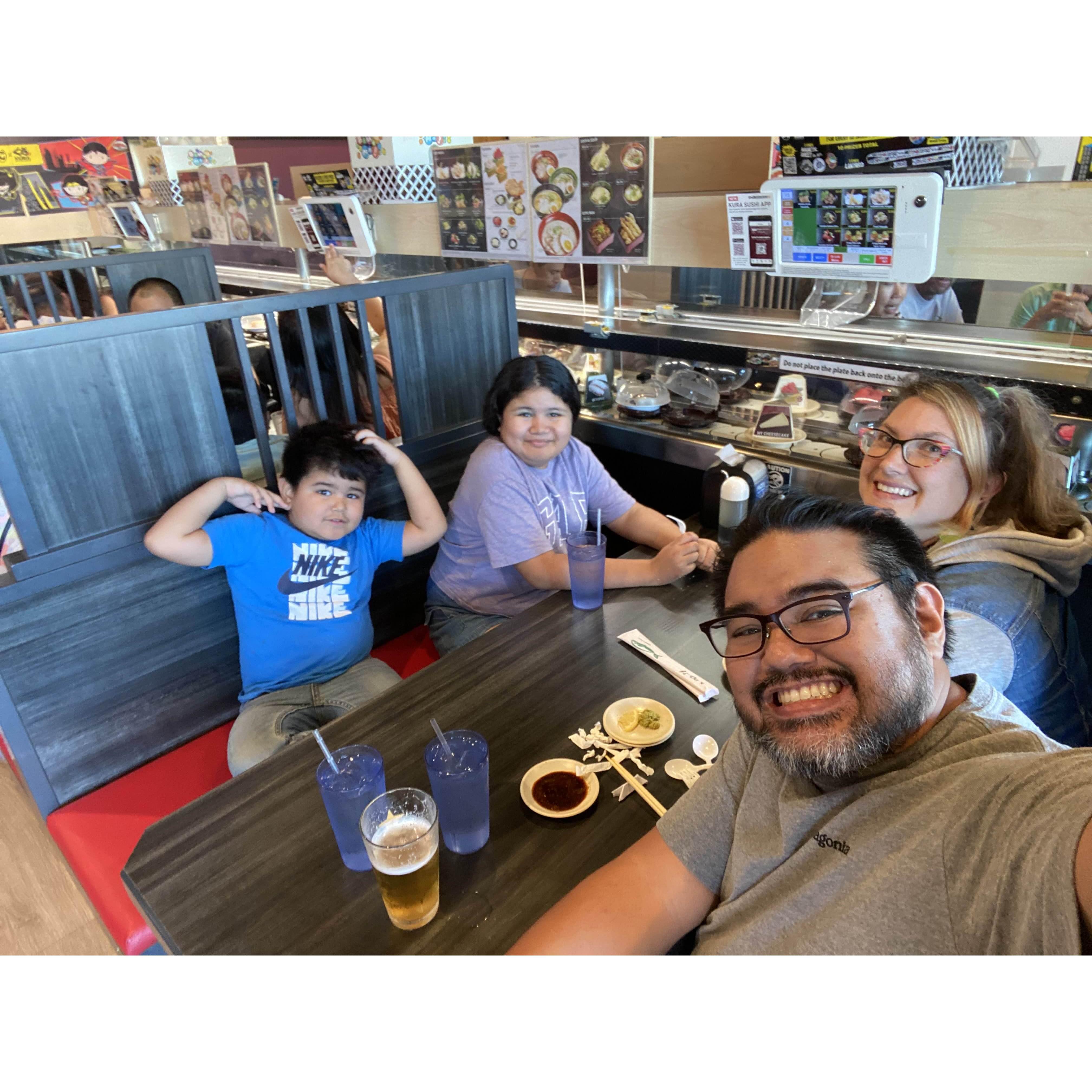 The kids' first time experiencing a revolving sushi bar!