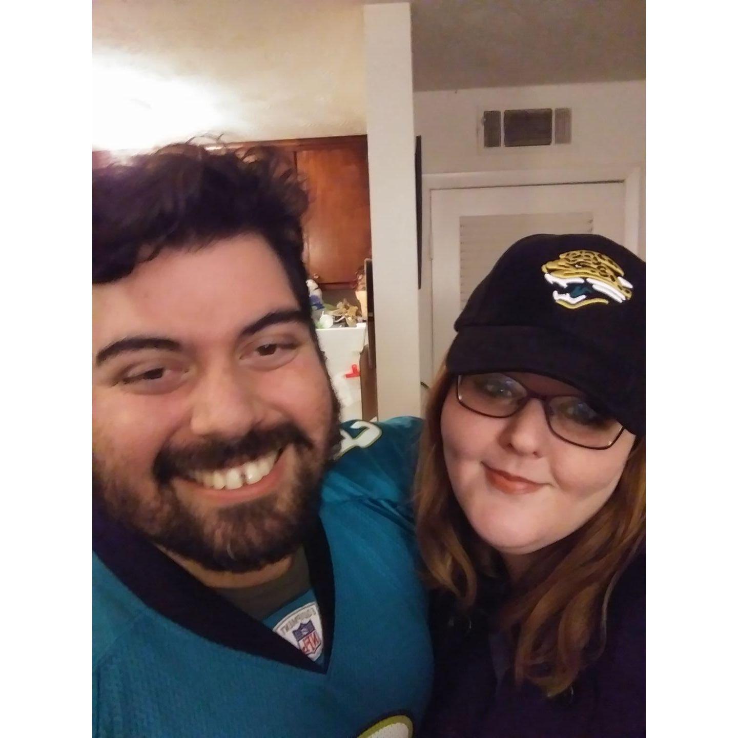 The first time he made her watch a sportsball game. She lost a bet and had to wear the hat.